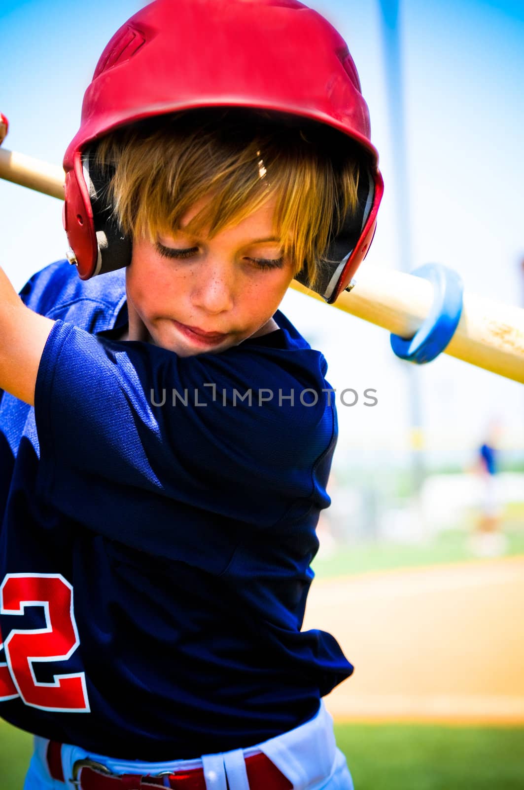 Baseball player swinging a bat.