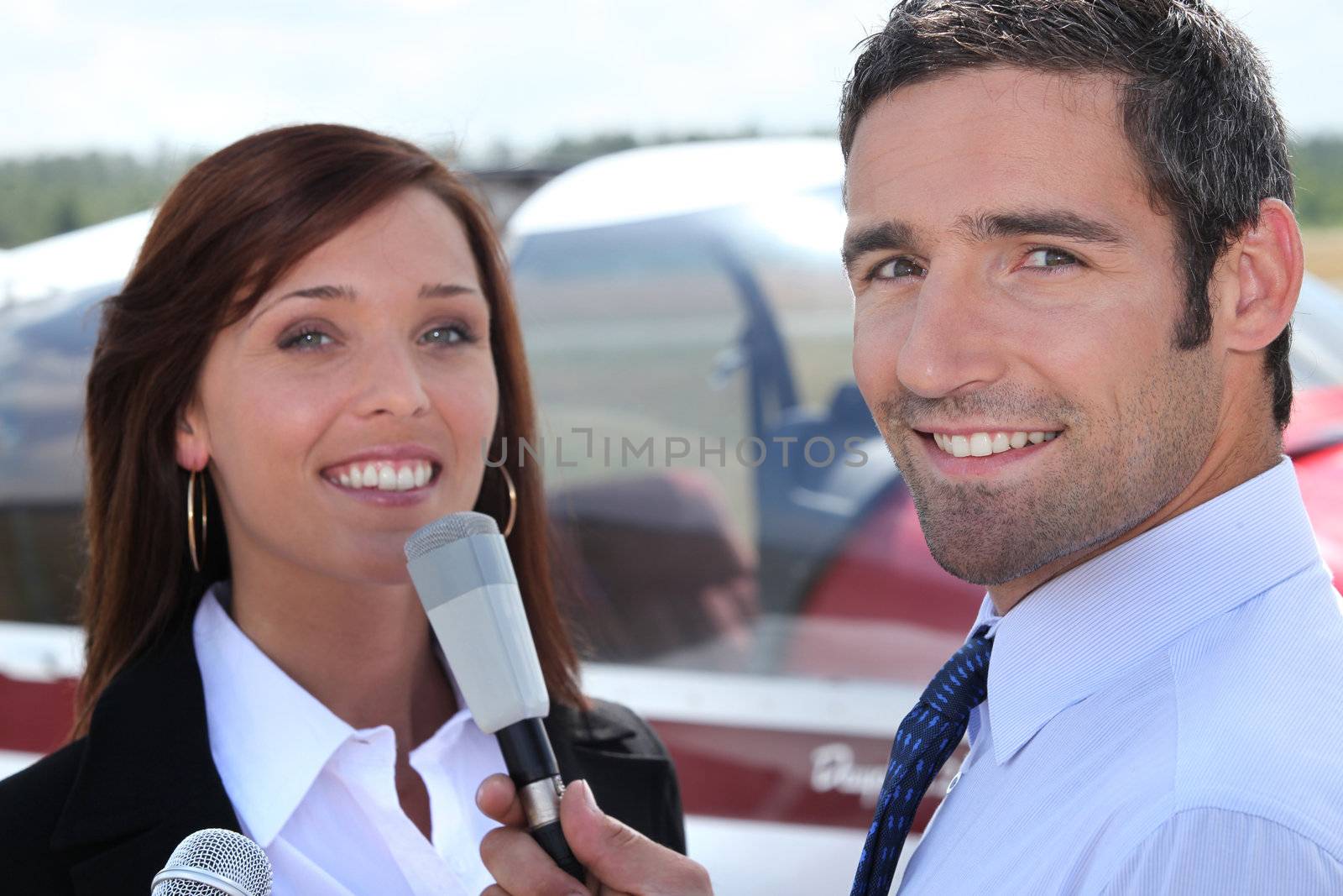 Reporter interviewing young man