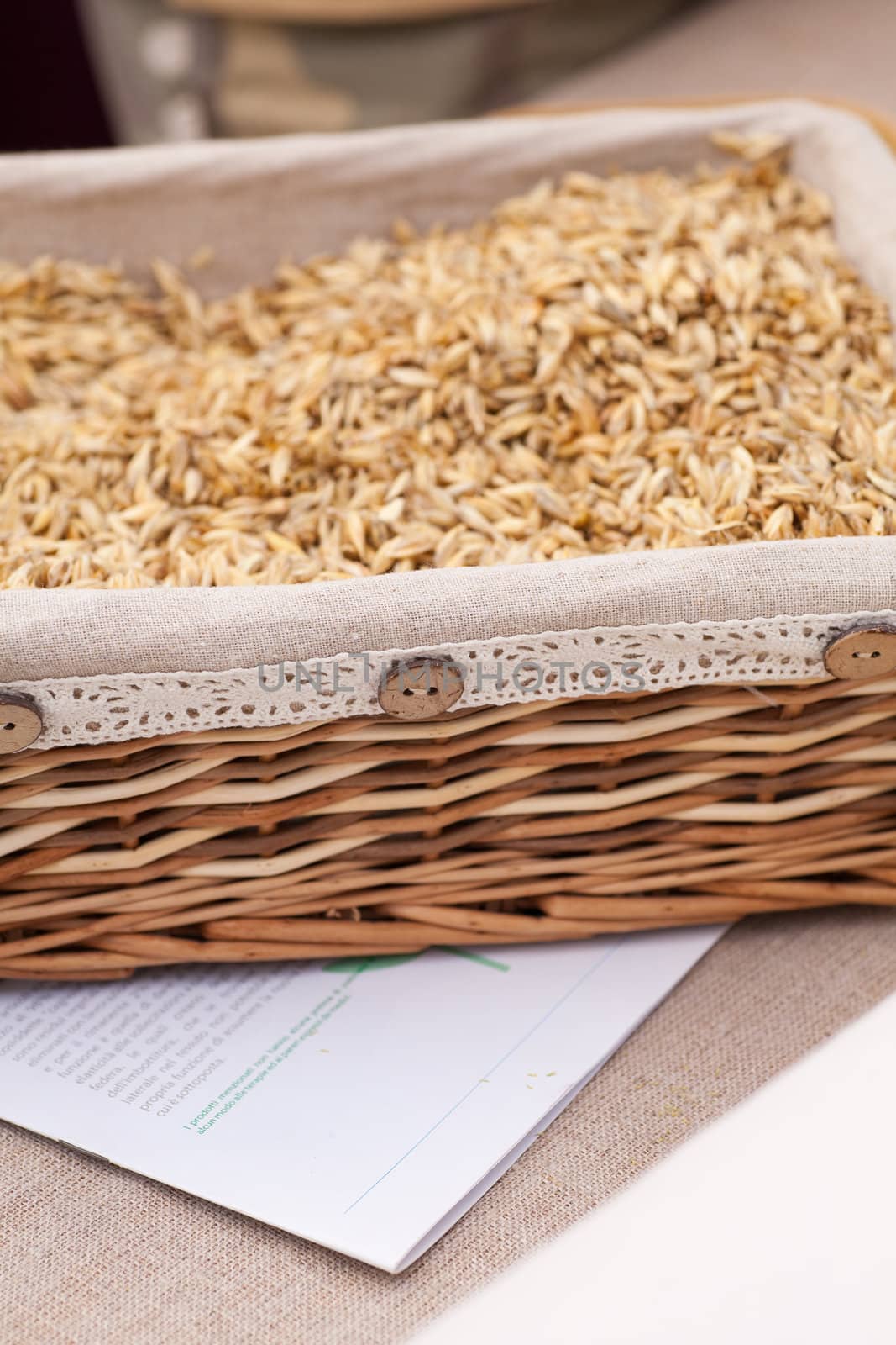 Spelled in a wicker basket on the table