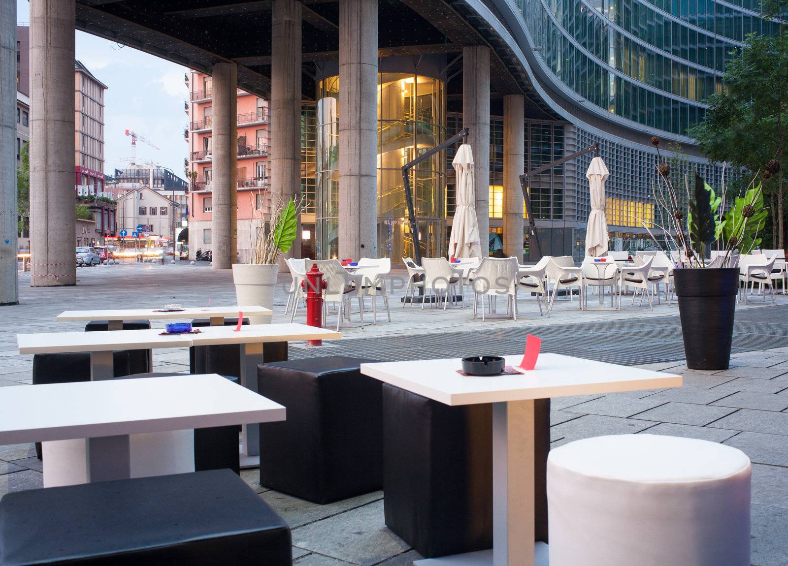 Little tables and stools in a outdoor pub