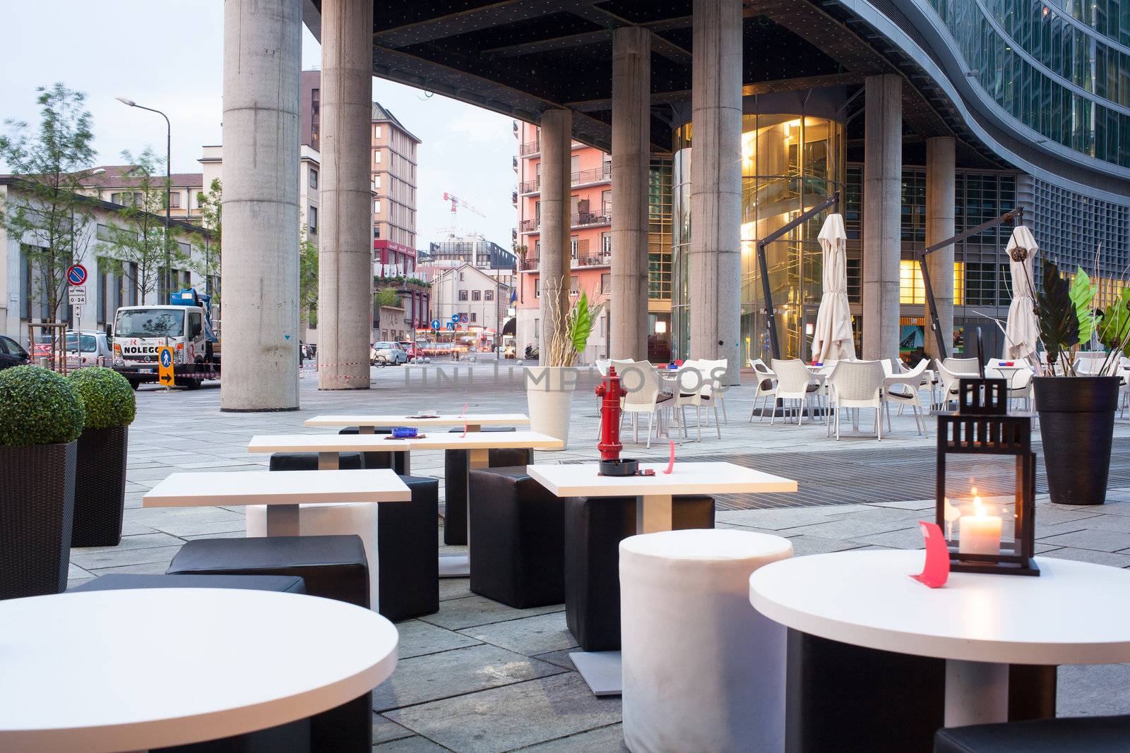 Little tables and stools in a outdoor pub