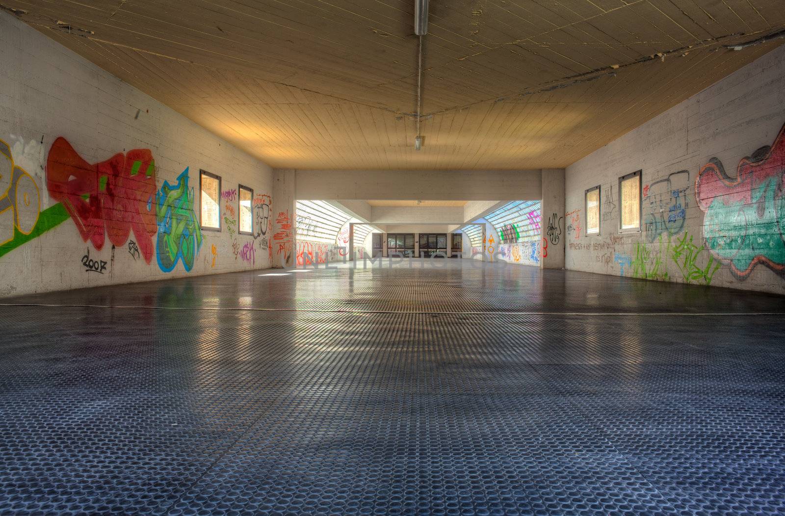 View of tunnel with graffiti in Trieste