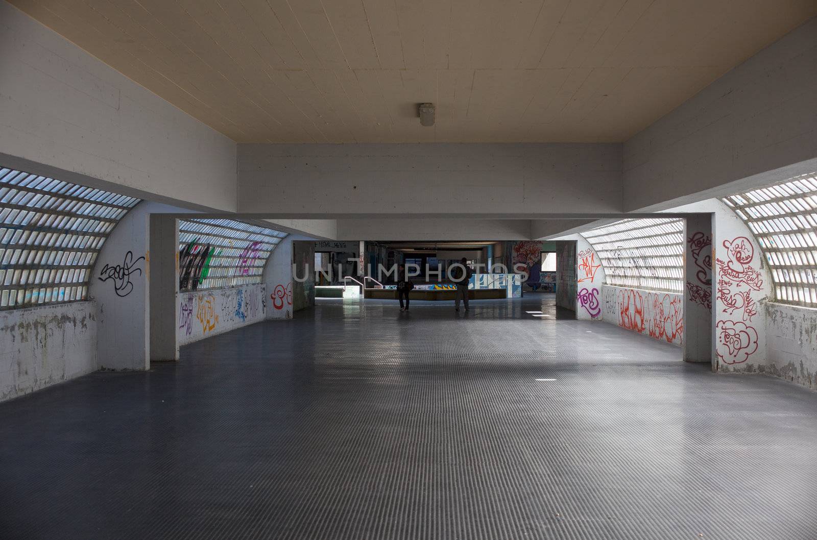 View of tunnel with graffiti in Trieste