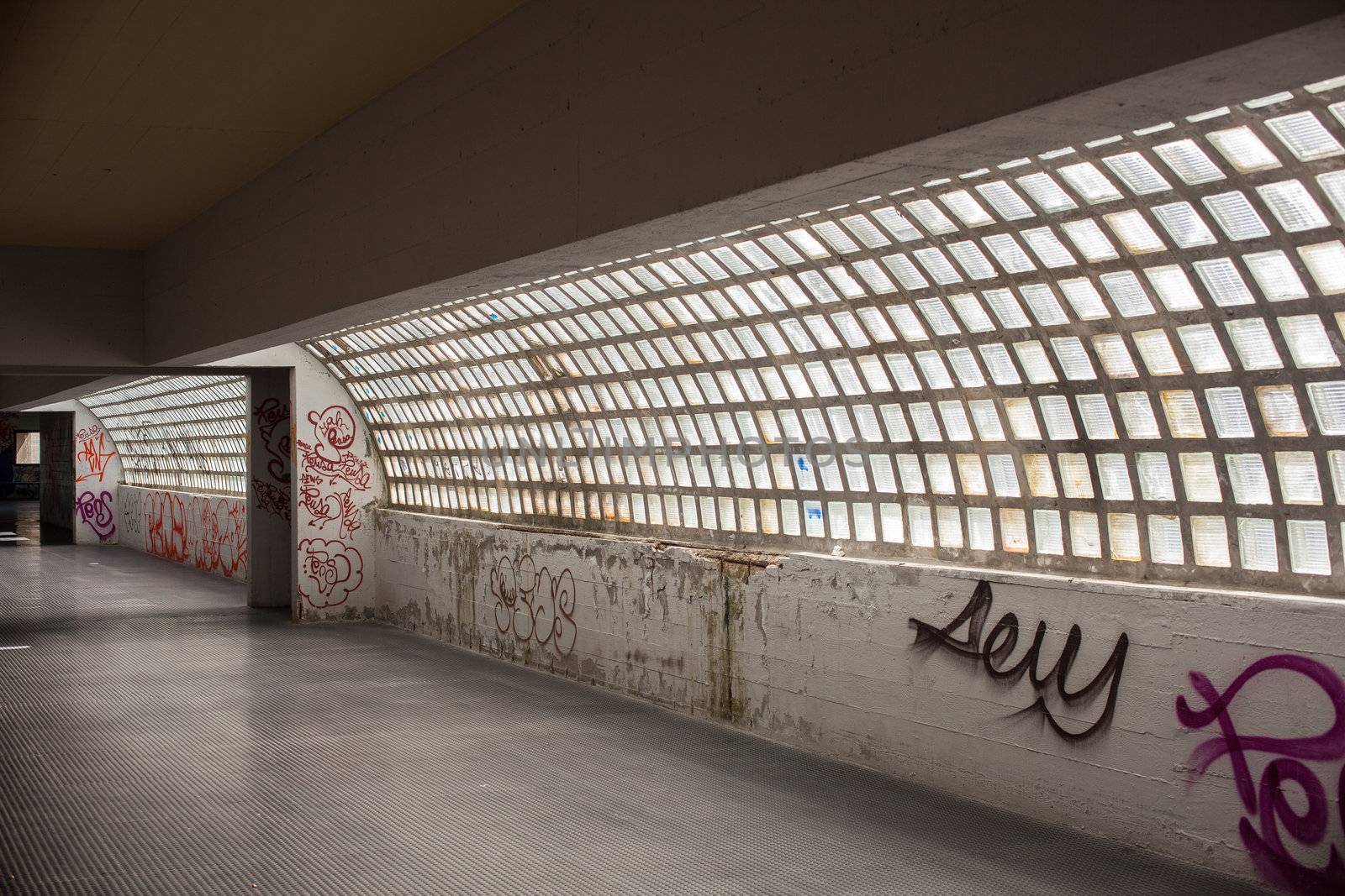 View of tunnel with graffiti in Trieste
