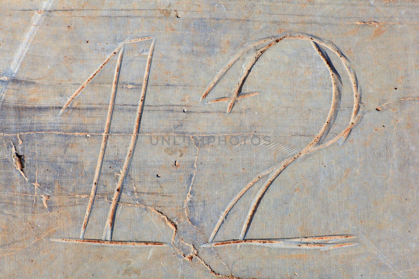 Photo of Numbers twelve etched in stone