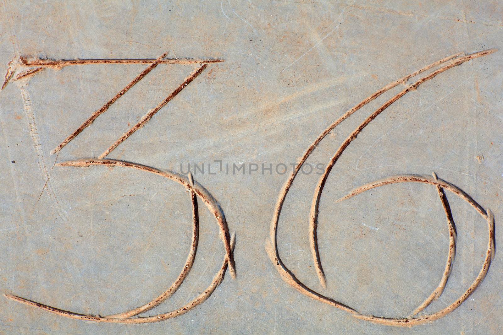 Photo of Numbers thirty-six etched in stone