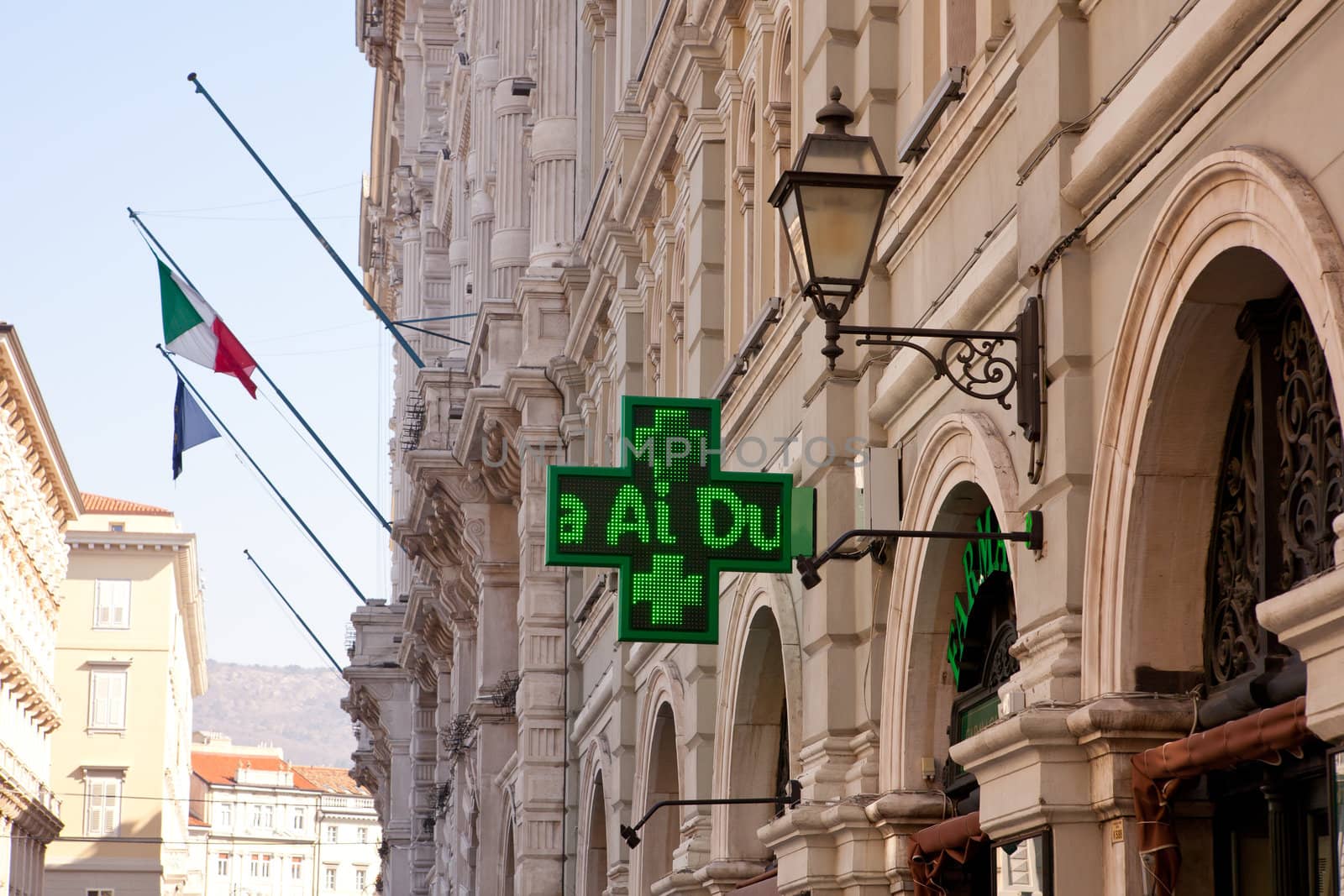 Pharmacy lighted sign in Trieste building