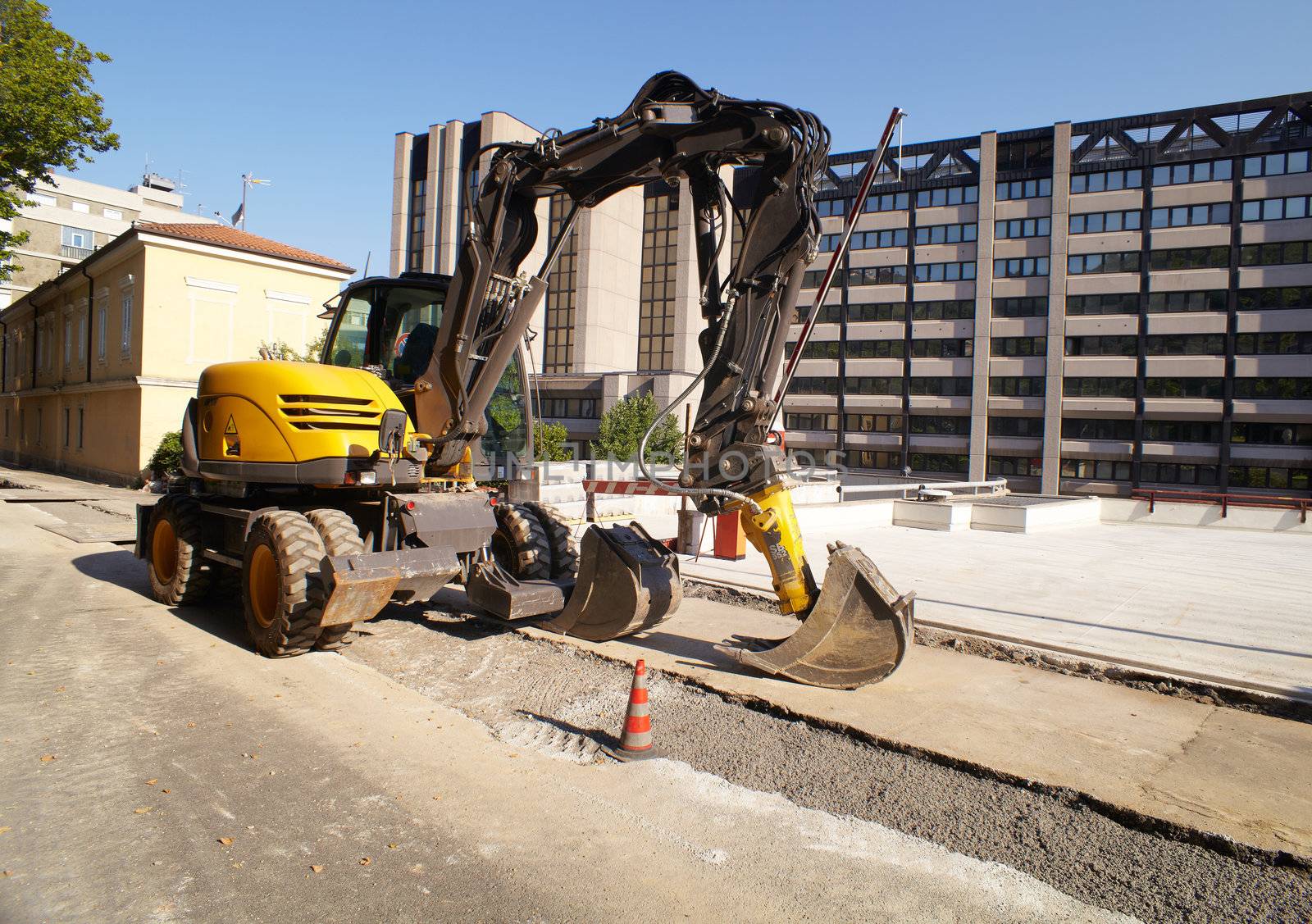 Construction site, excavator working in the street