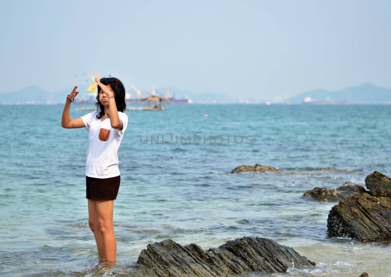 Funny young woman on beach summer holiday