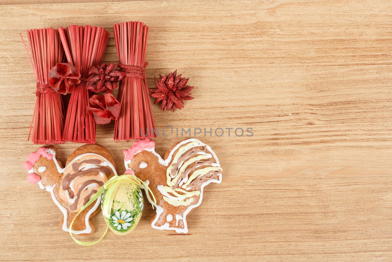 Easter ginger breads,egg and painted egg on wooden background