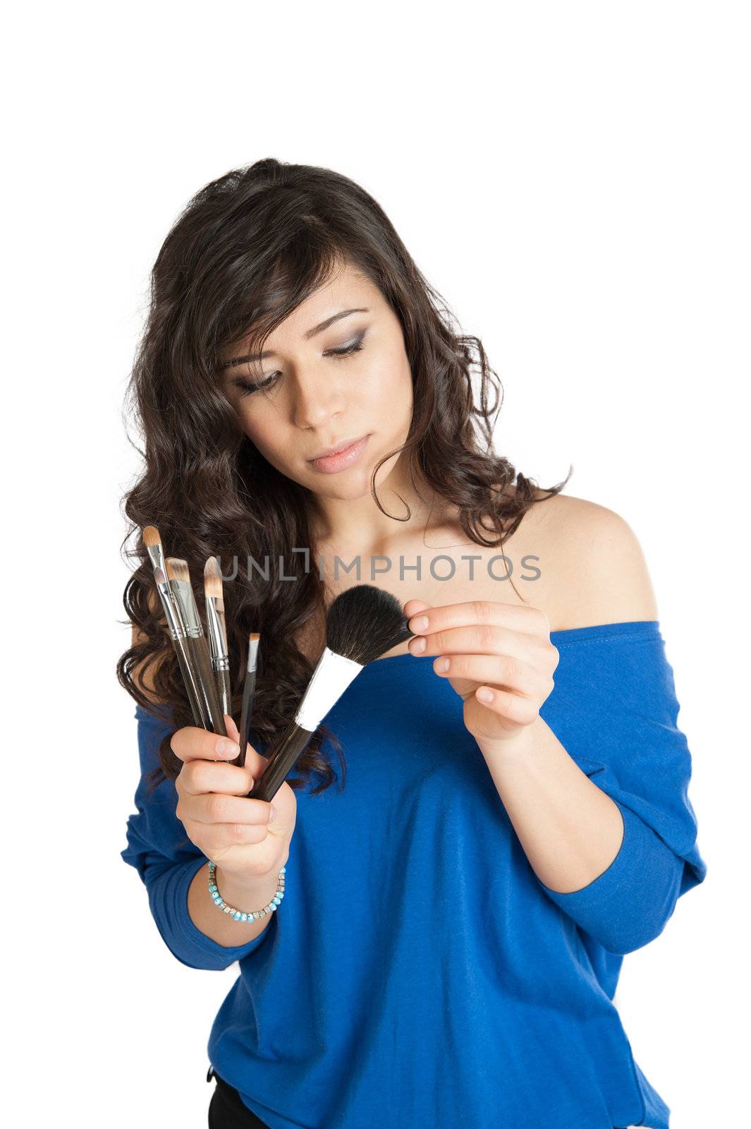 beautiful brunette holding a makeup brush