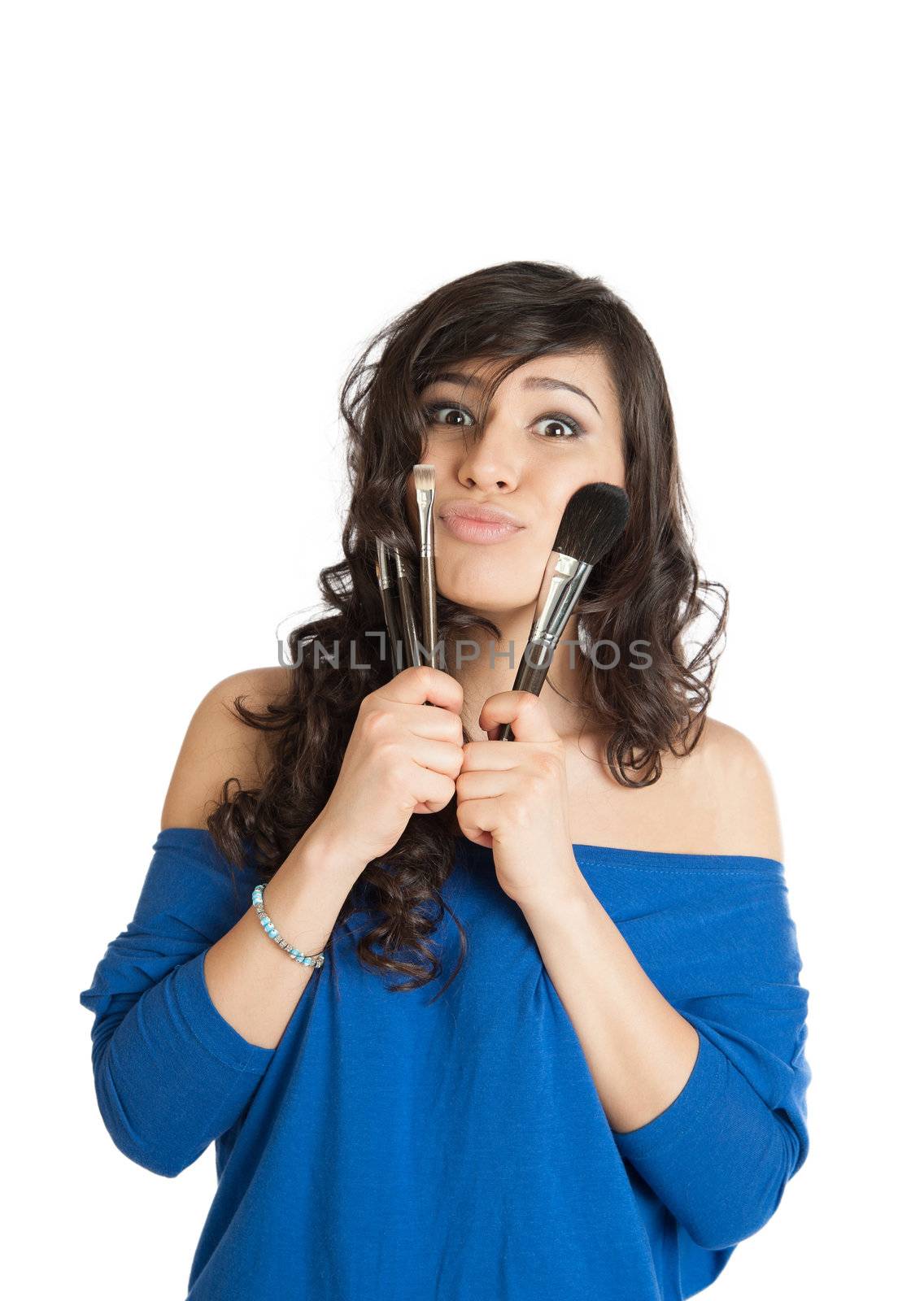 beautiful brunette holding a makeup brush