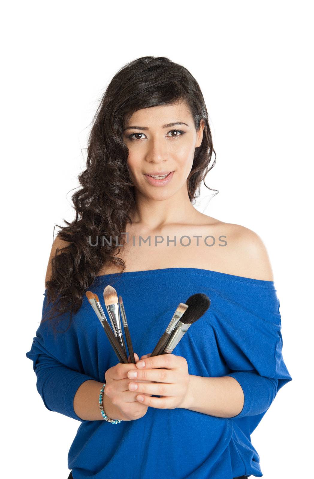 beautiful brunette holding a makeup brush