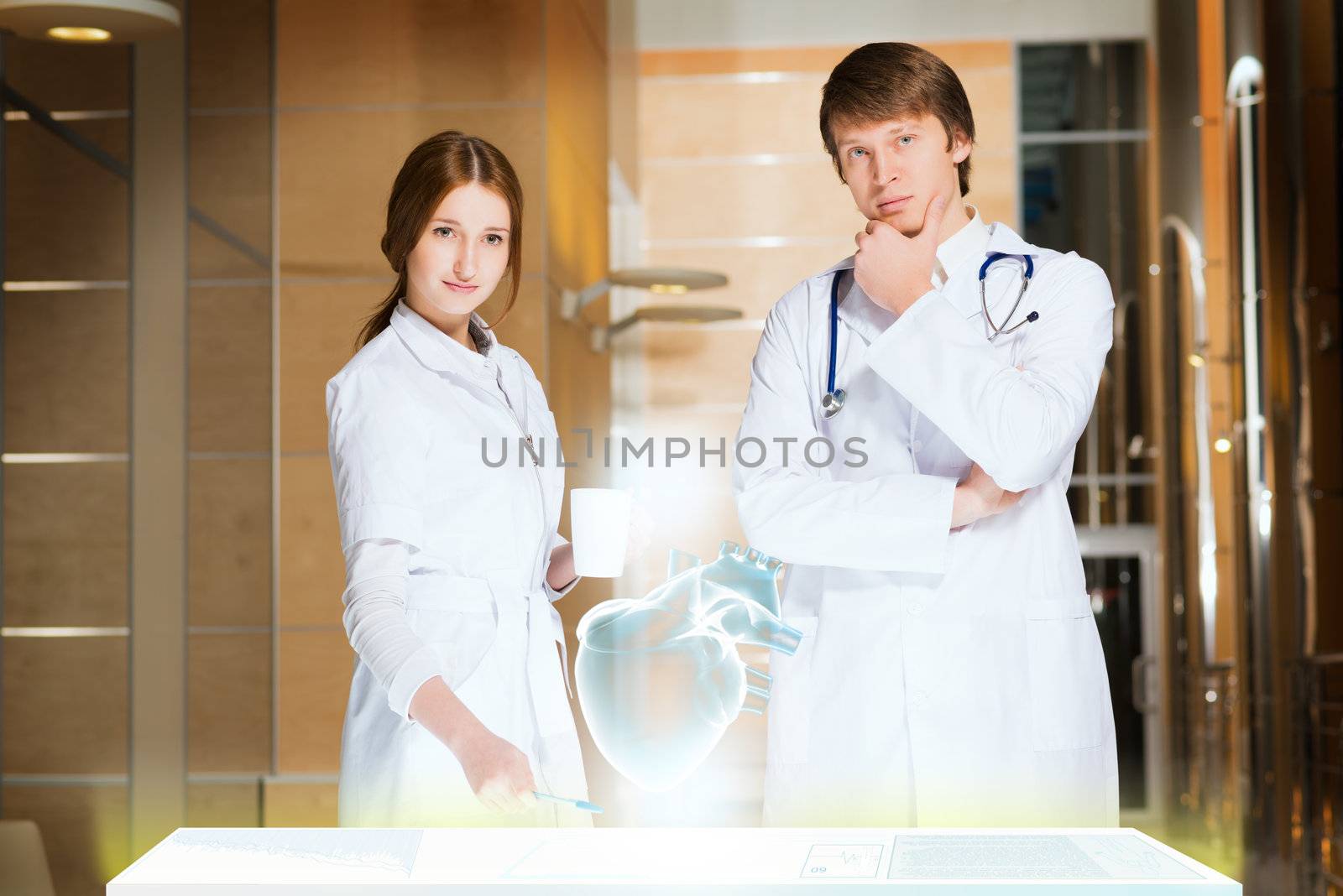 two doctors stand near glowing table discussing. projected objects on a desk