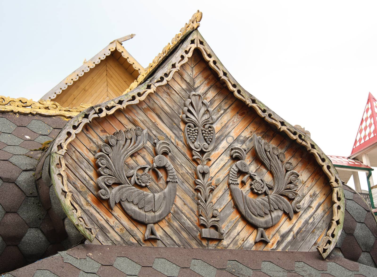 Traditional wooden Russian architecture with carved birds decoration