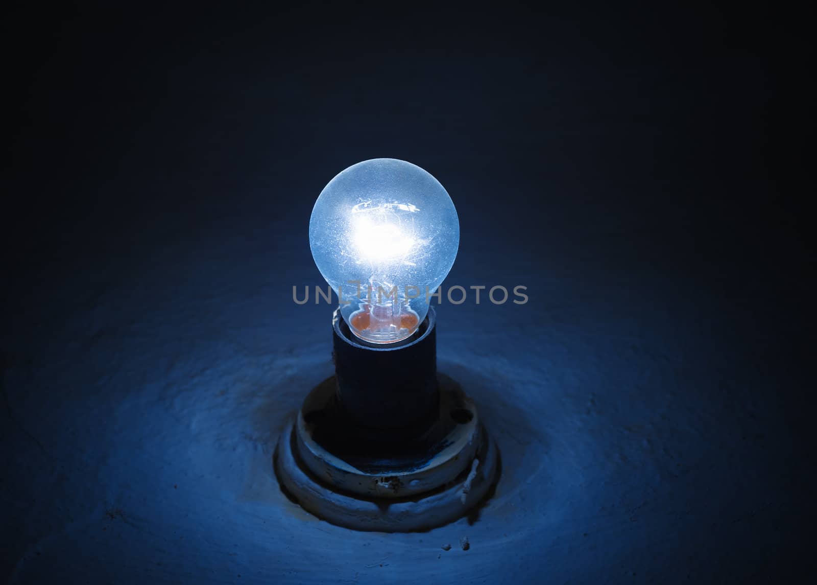 old blue lamp lighting in a dark room
