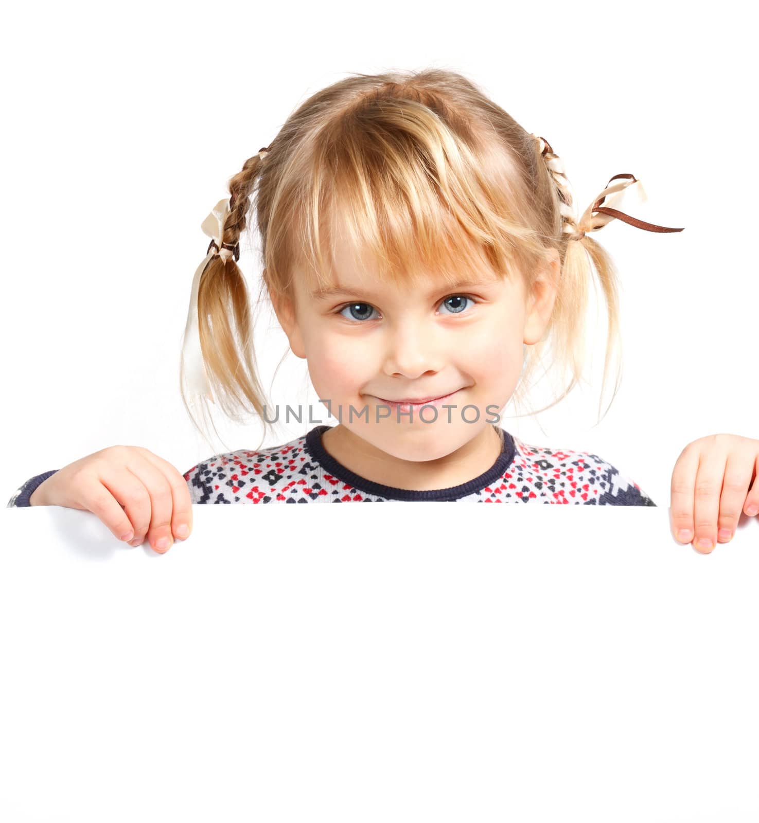 Cute little girl holding a white board