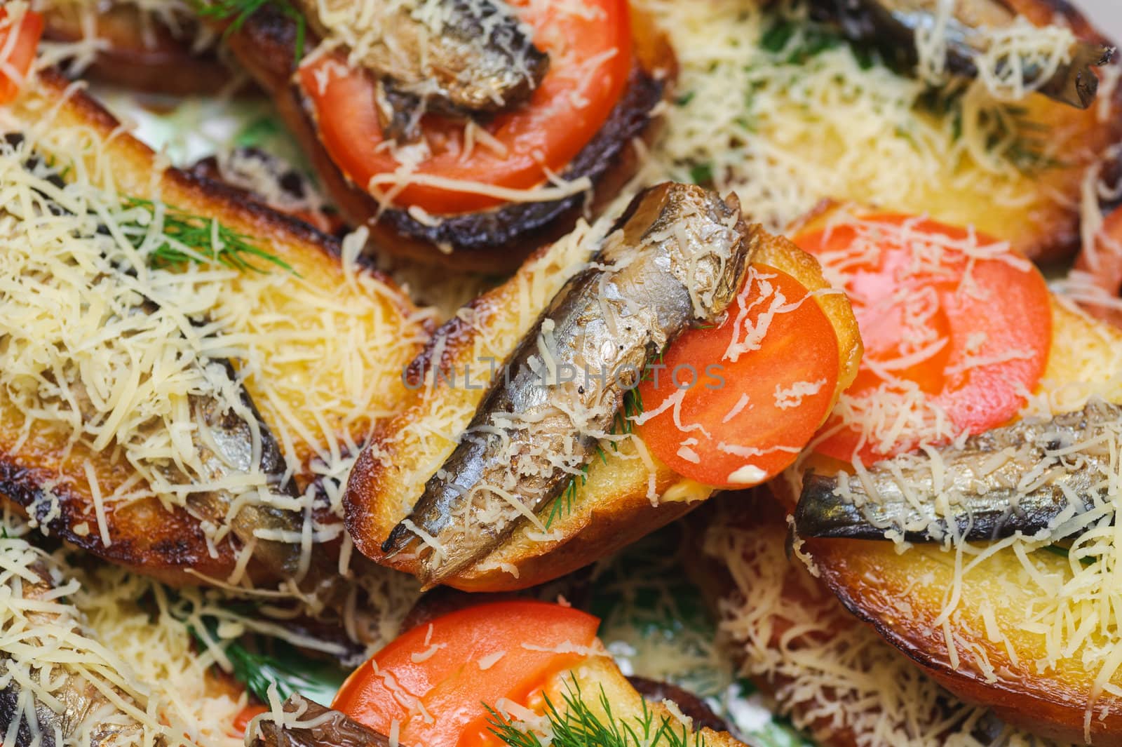 bread with sprats, tomato and cheese. delicacy gourmet food backgrounds