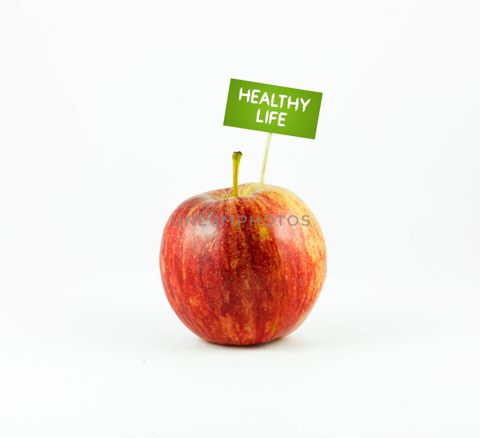 A red Apple isolated on white background with a Healthy Life sign. 