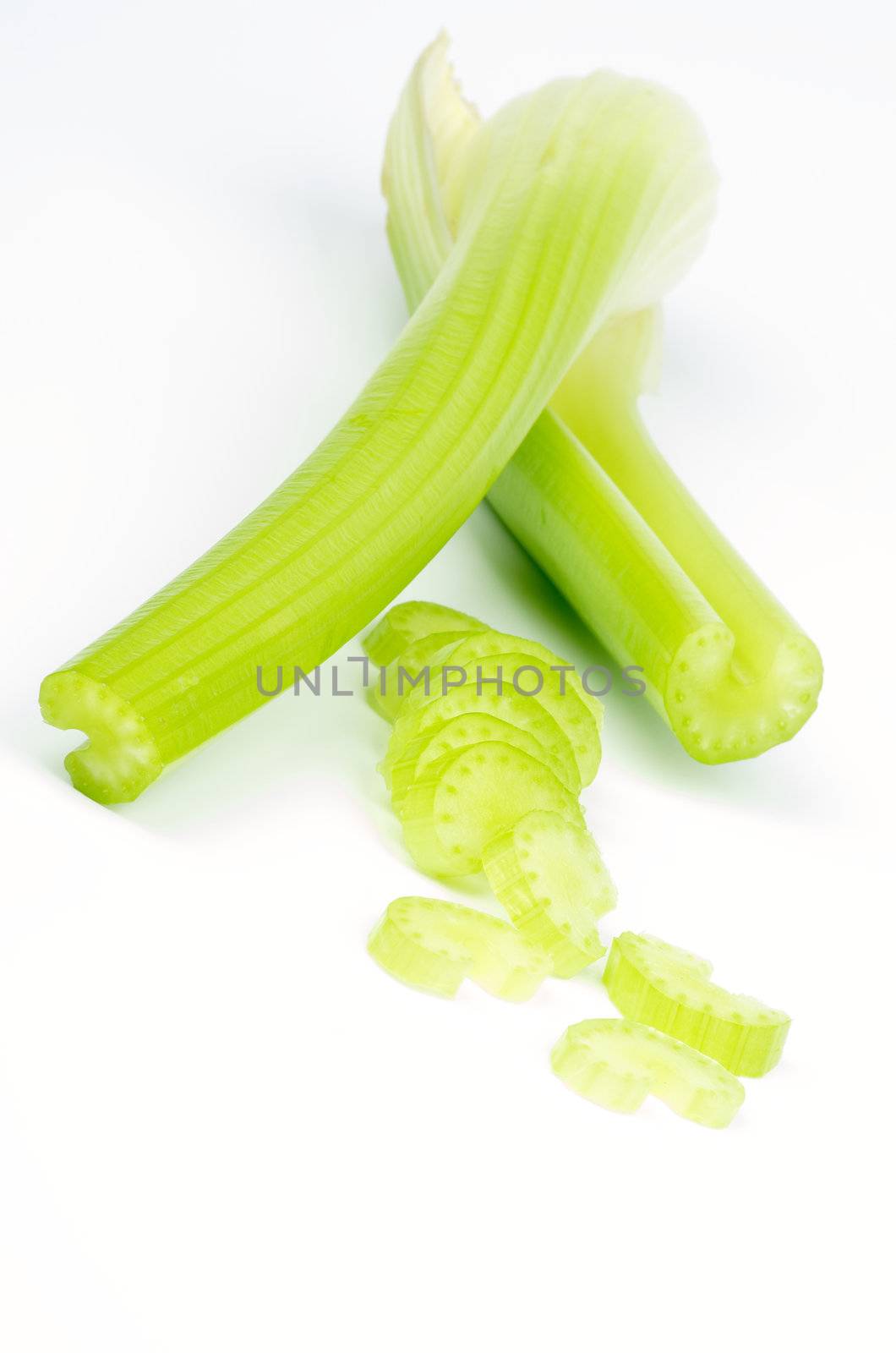 Arrangement of Celery Stalks and Rings isolated on white background