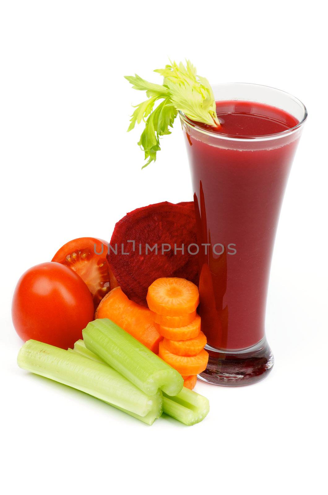 Arrangement of Beet, Carrot, Tomatoes, Celery and High Glass of Vegetable Juice isolated on white background