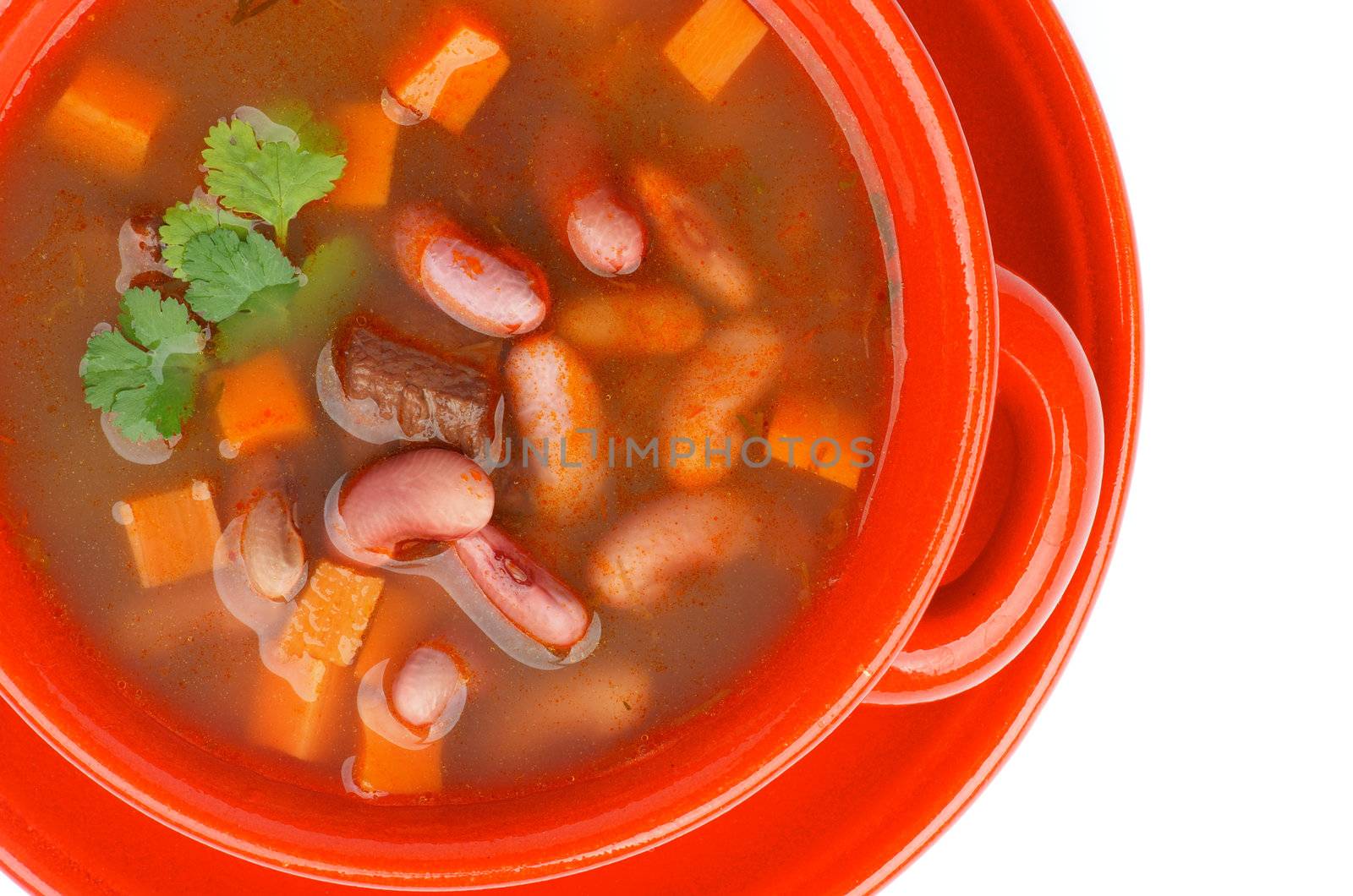 Traditional Red Bean Soup with Beef and Carrot in Red Bowl. Top View