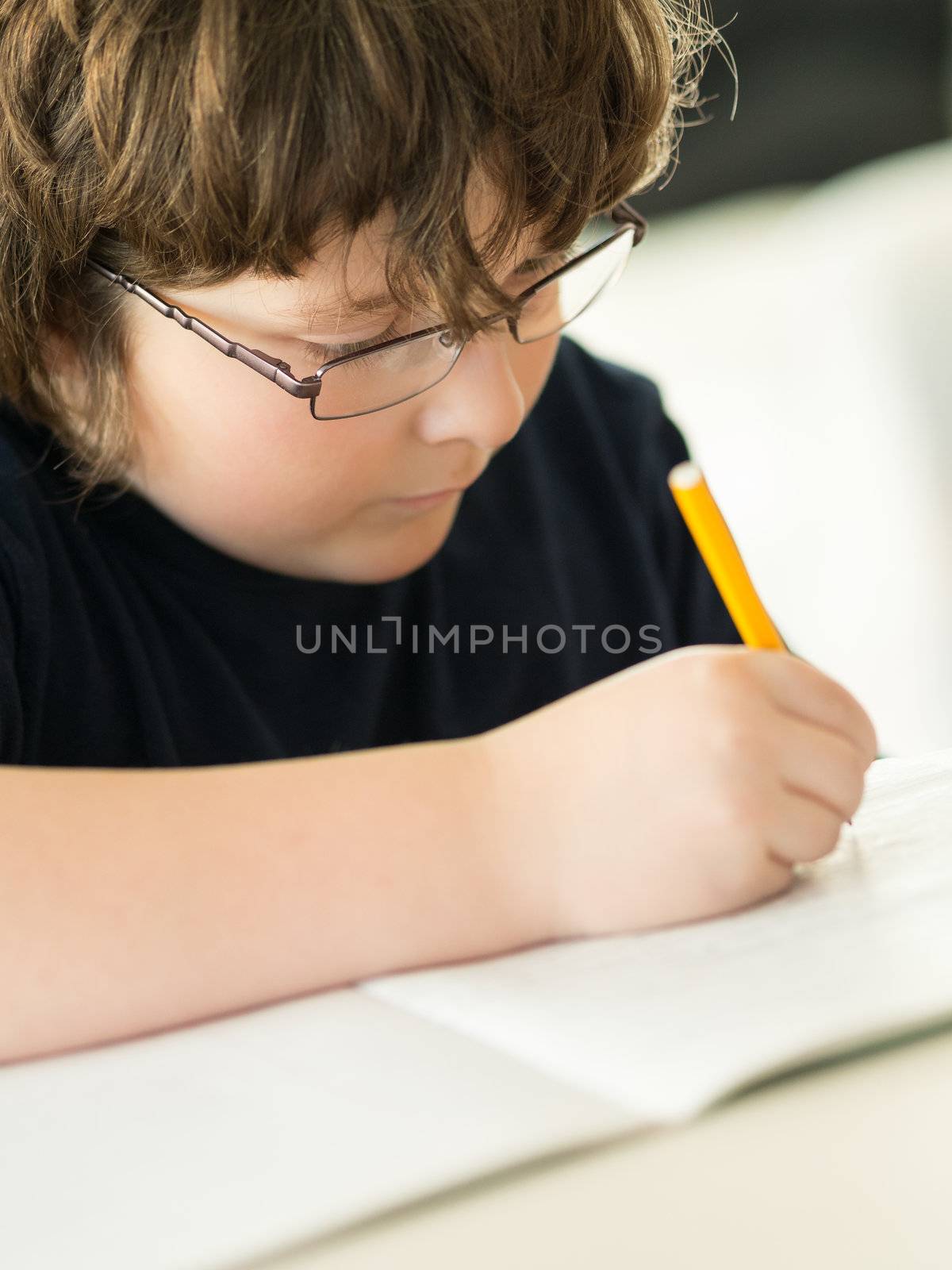Cute little boy doing his homework