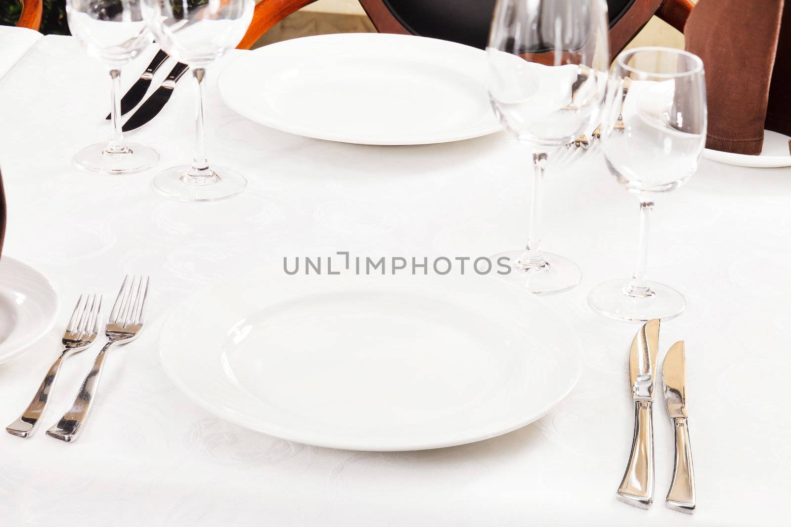 Tables set for meal  by shebeko