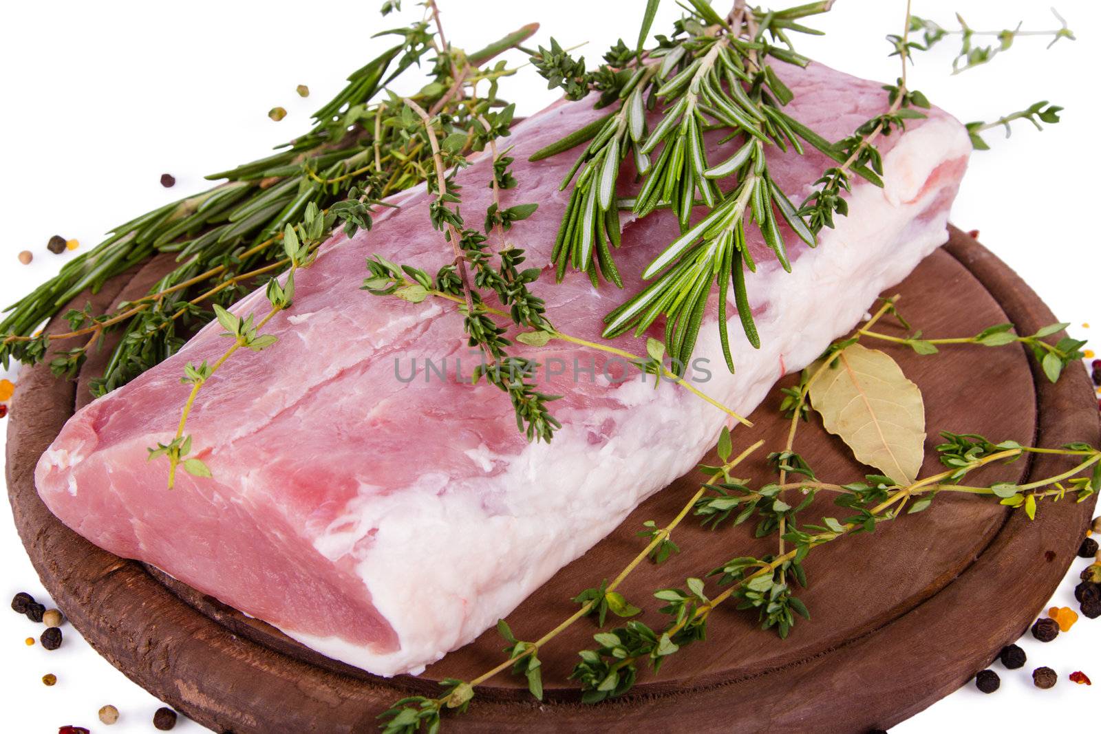 Raw fresh meat on cutting board with condiments on white background