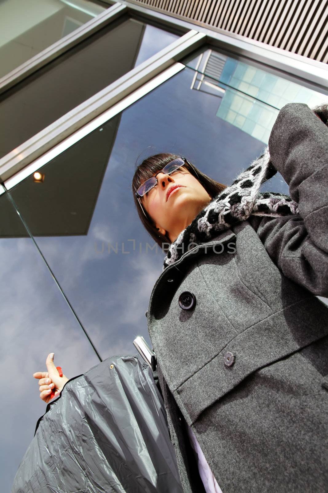 A business woman carrying protected clothes.