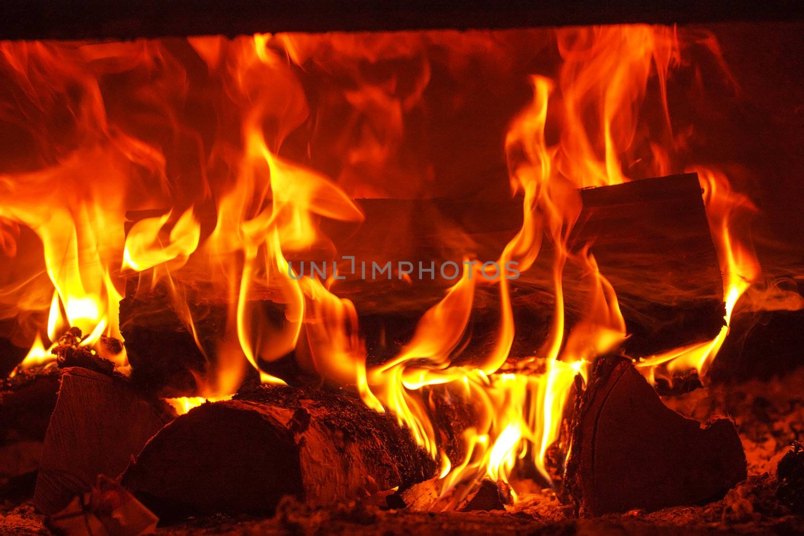 Fire in fireplace by shebeko