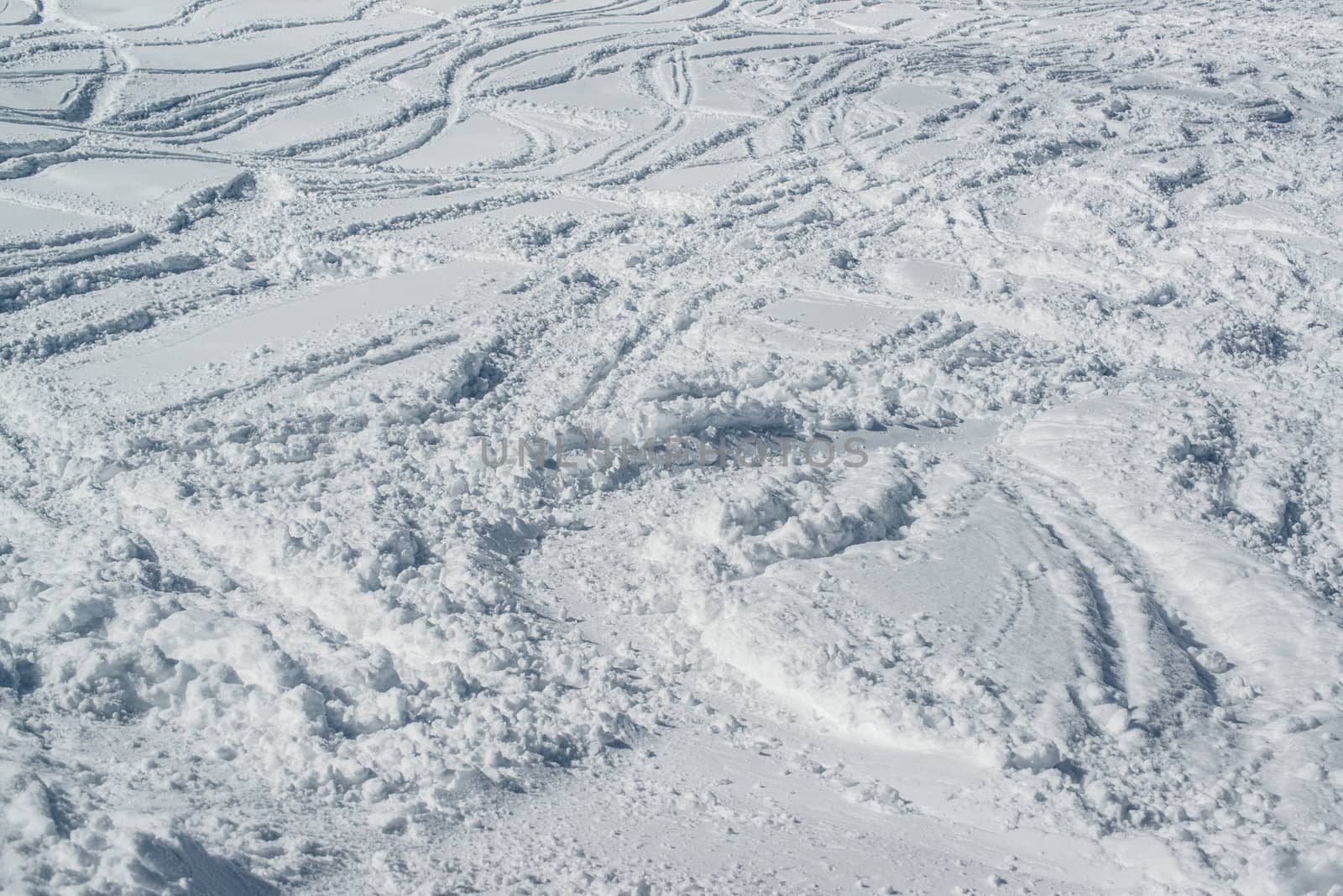 Ski tracks in the powder snow - skiing background