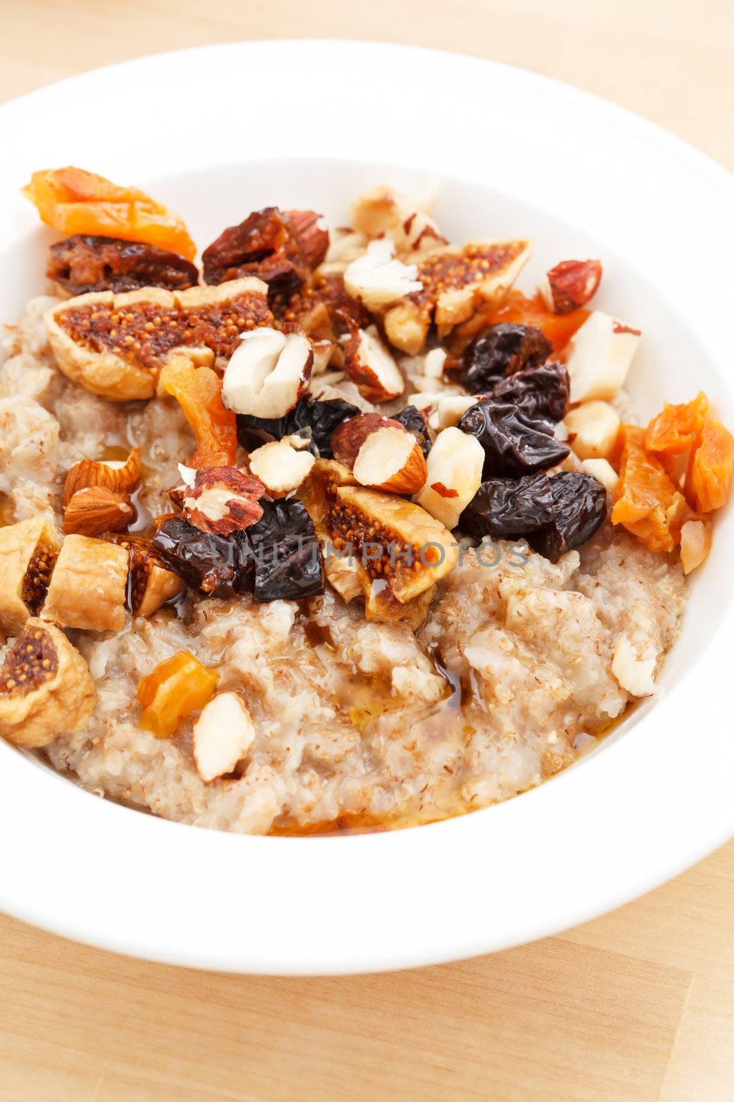 oatmeal with raisins, nuts and maple syrup