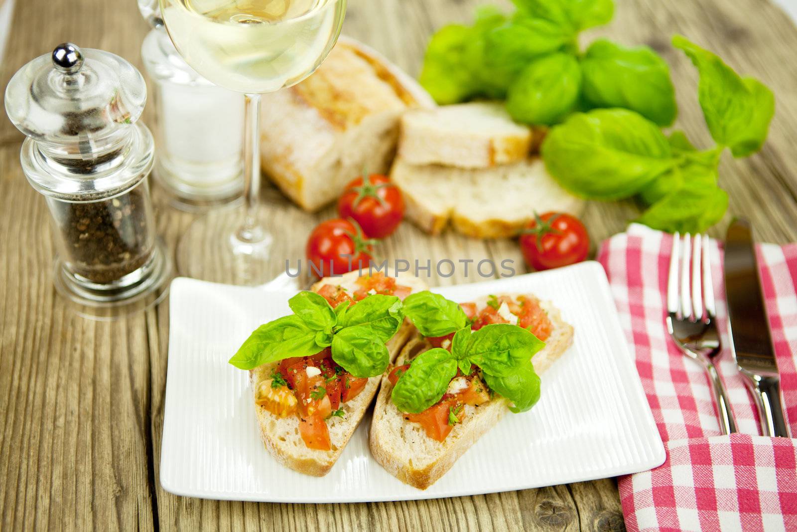 fresh tasty italian bruschetta with tomato on wooden background