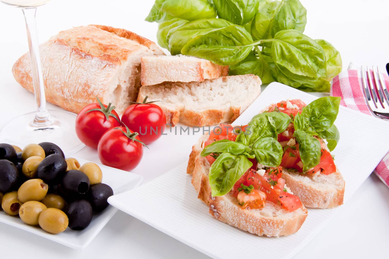 deliscious fresh bruschetta appetizer with tomatoes isolated on white background