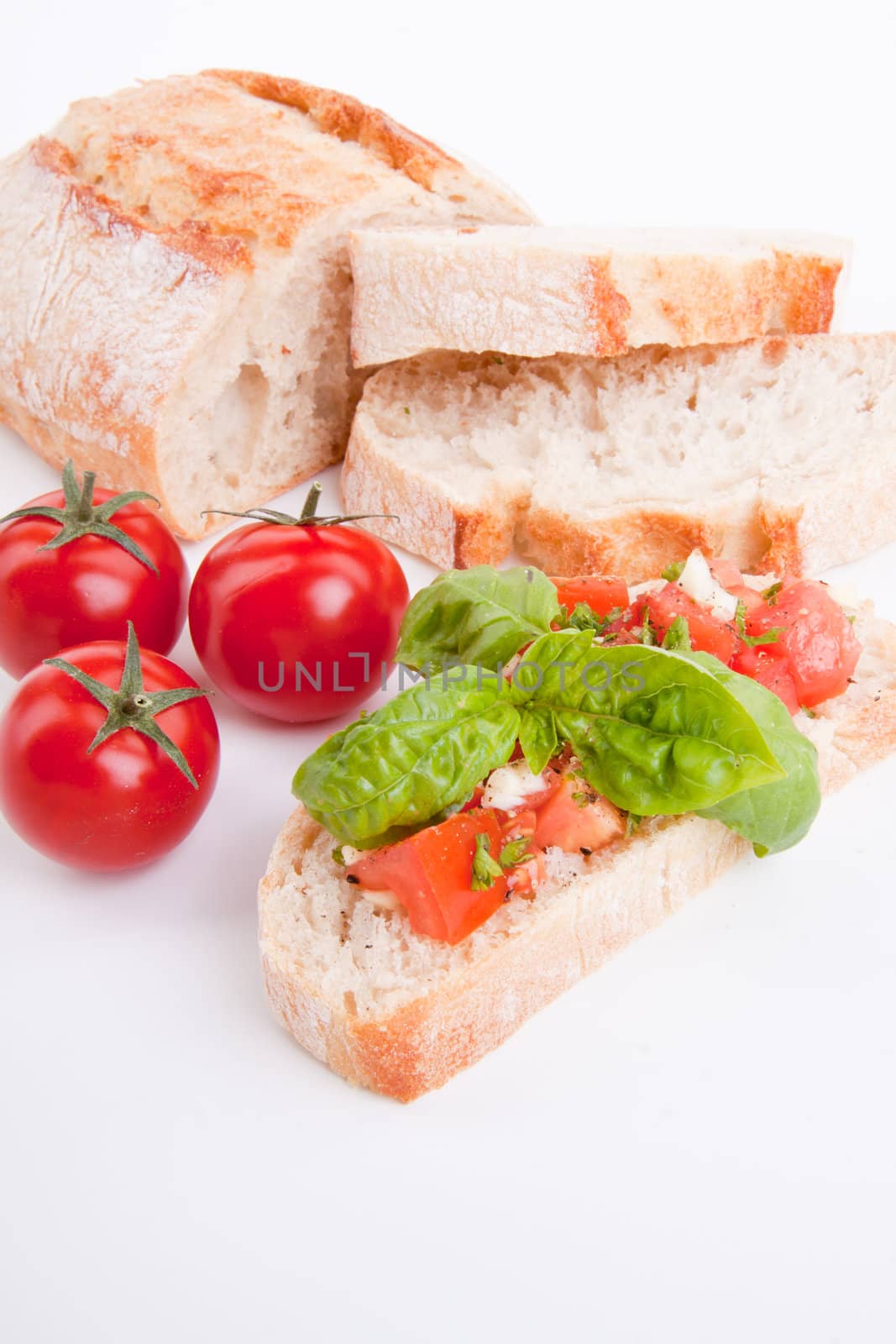 deliscious fresh bruschetta appetizer with tomatoes isolated on white background