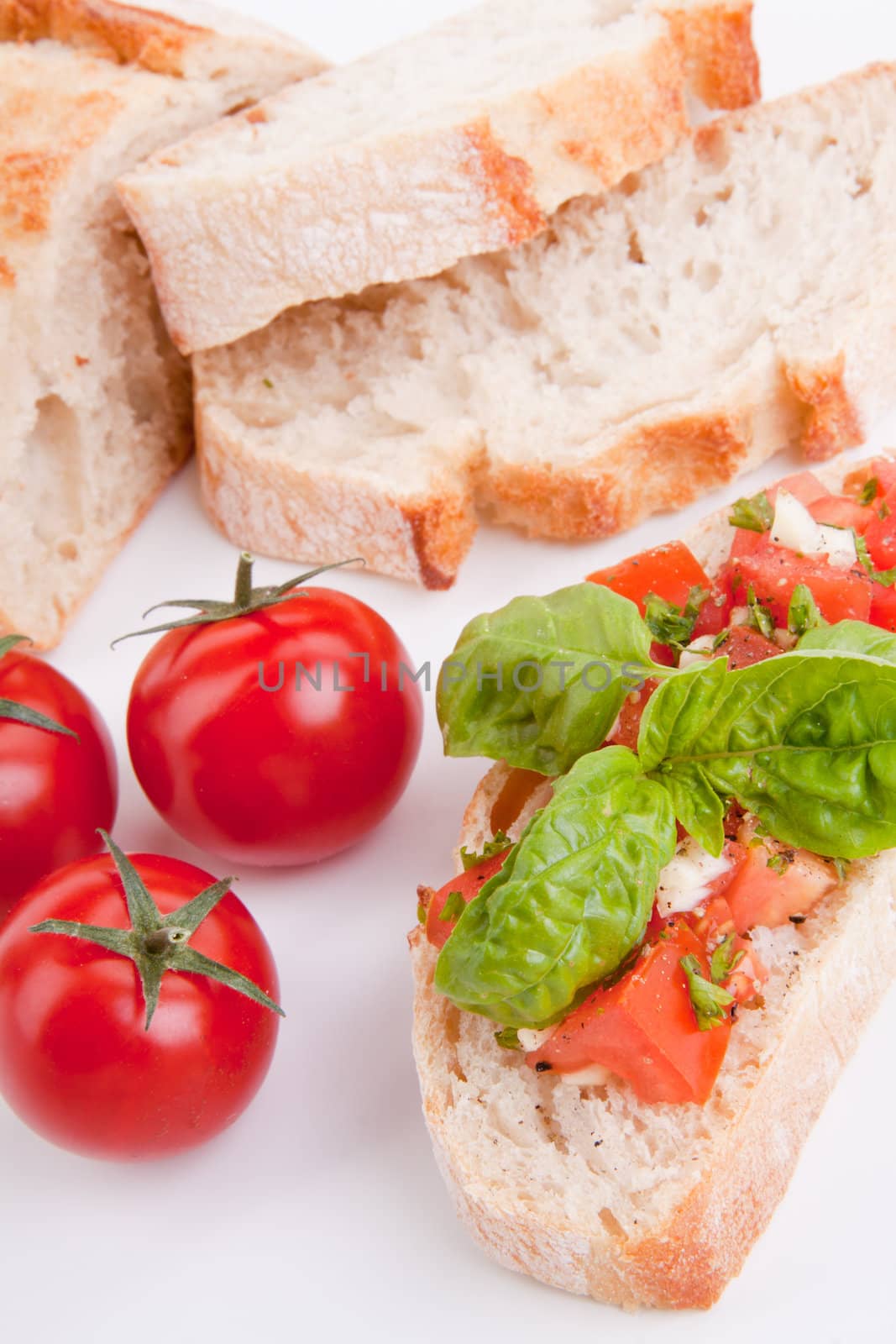 deliscious fresh bruschetta appetizer with tomatoes isolated on white background