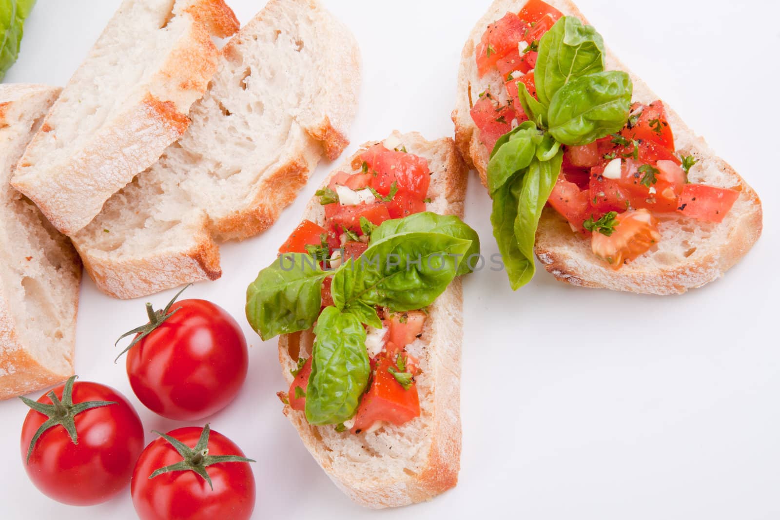 deliscious fresh bruschetta appetizer with tomatoes isolated on white background