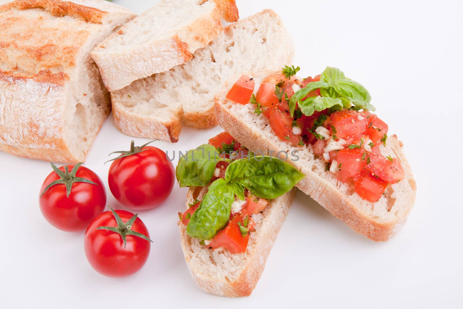 deliscious fresh bruschetta appetizer with tomatoes isolated on white background