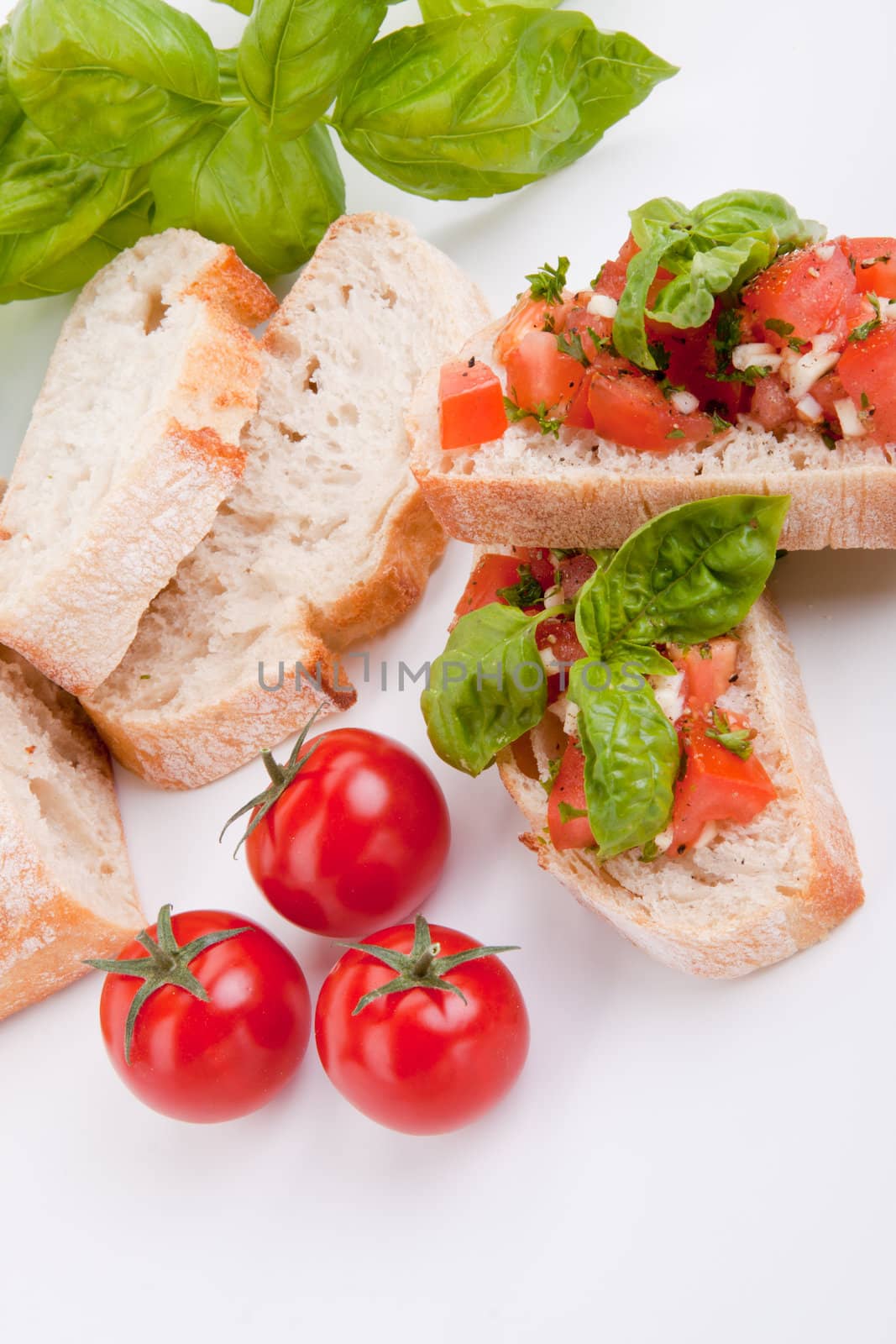 deliscious fresh bruschetta appetizer with tomatoes isolated on white background