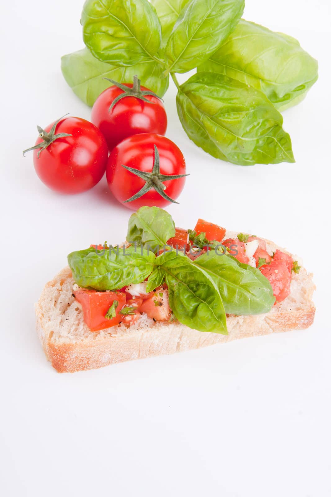 deliscious fresh bruschetta appetizer with tomatoes isolated on white background