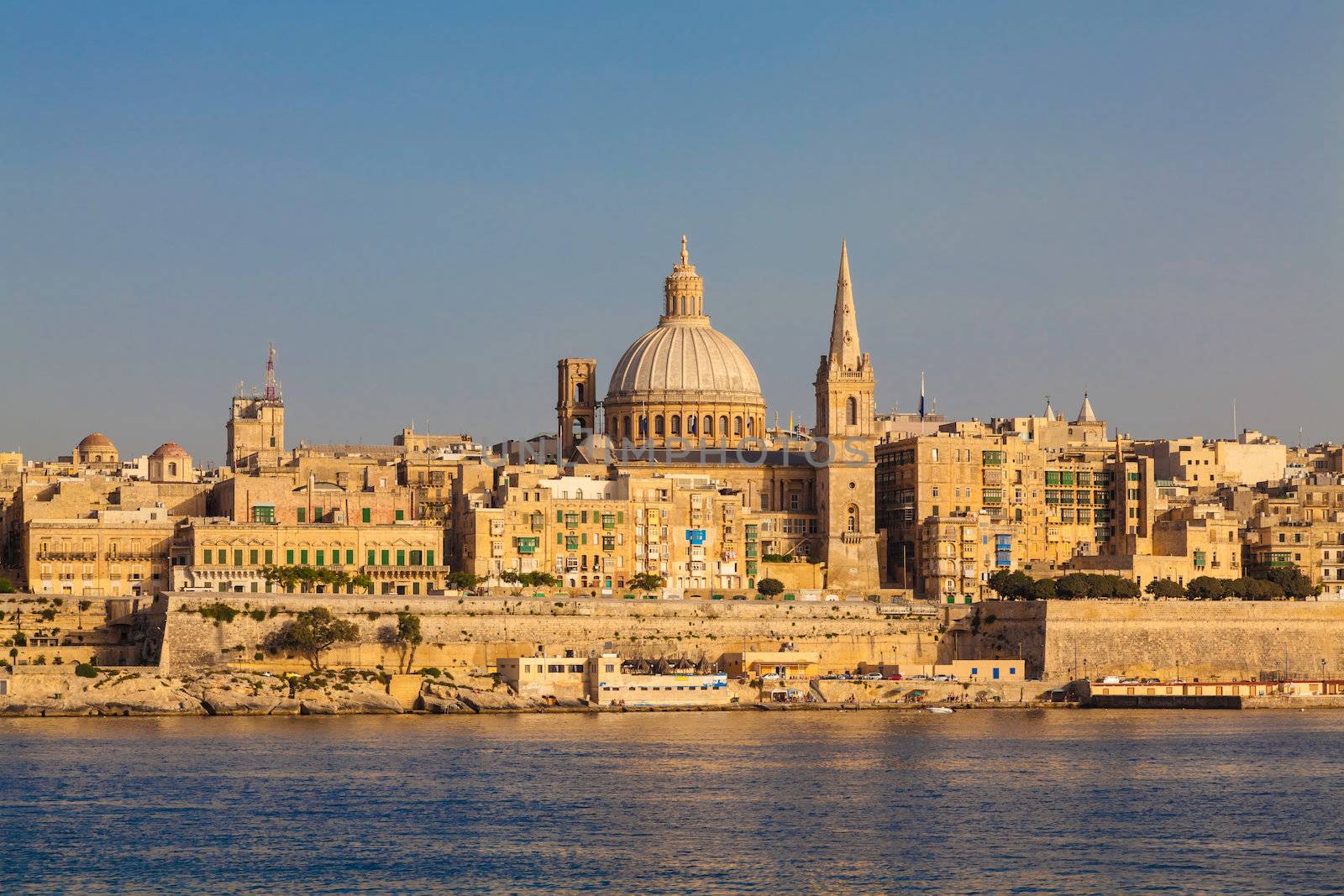 Skyline of the Maltese capital city Valletta in warm, late afternoon light