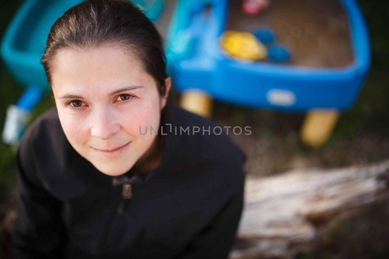 Happy mother in front of child toys