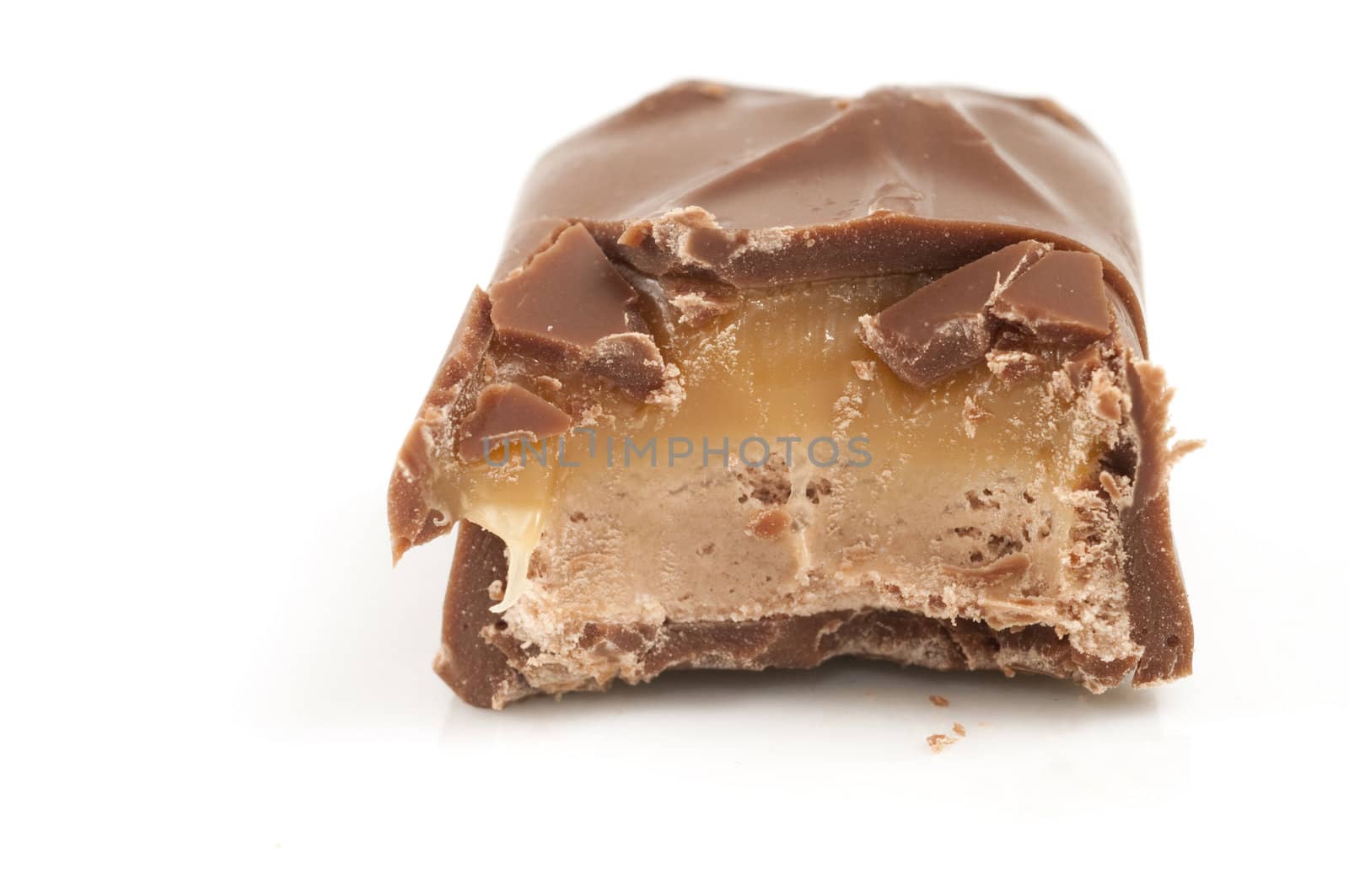 Bite from chocolate bar isolated on white background