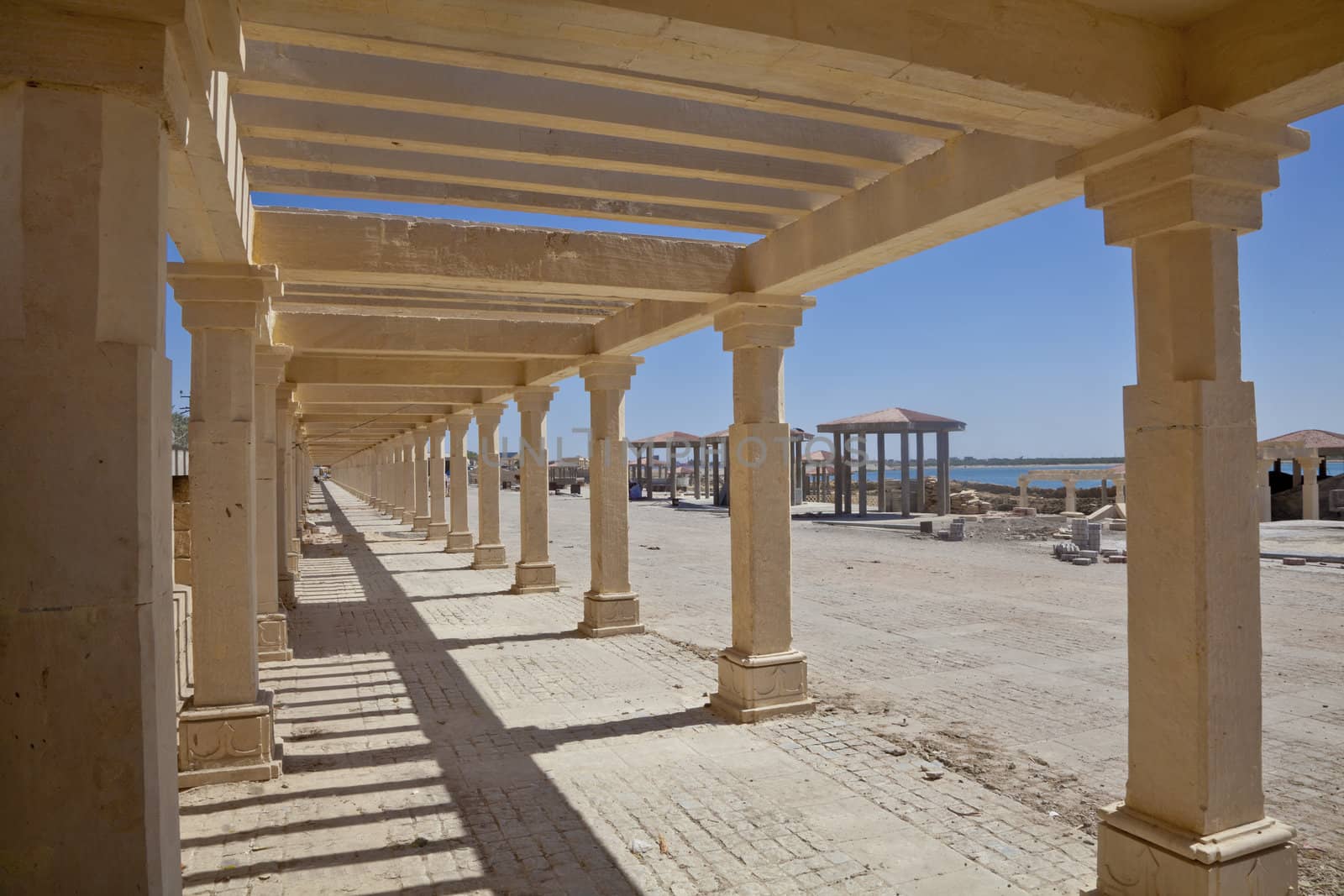 Dwarka Roadtrip. Landscape of the construction of a pagoda that is ongoing at Dwarka in Gujarat, Indian. Typical littering and builders rubble as throughout urban India