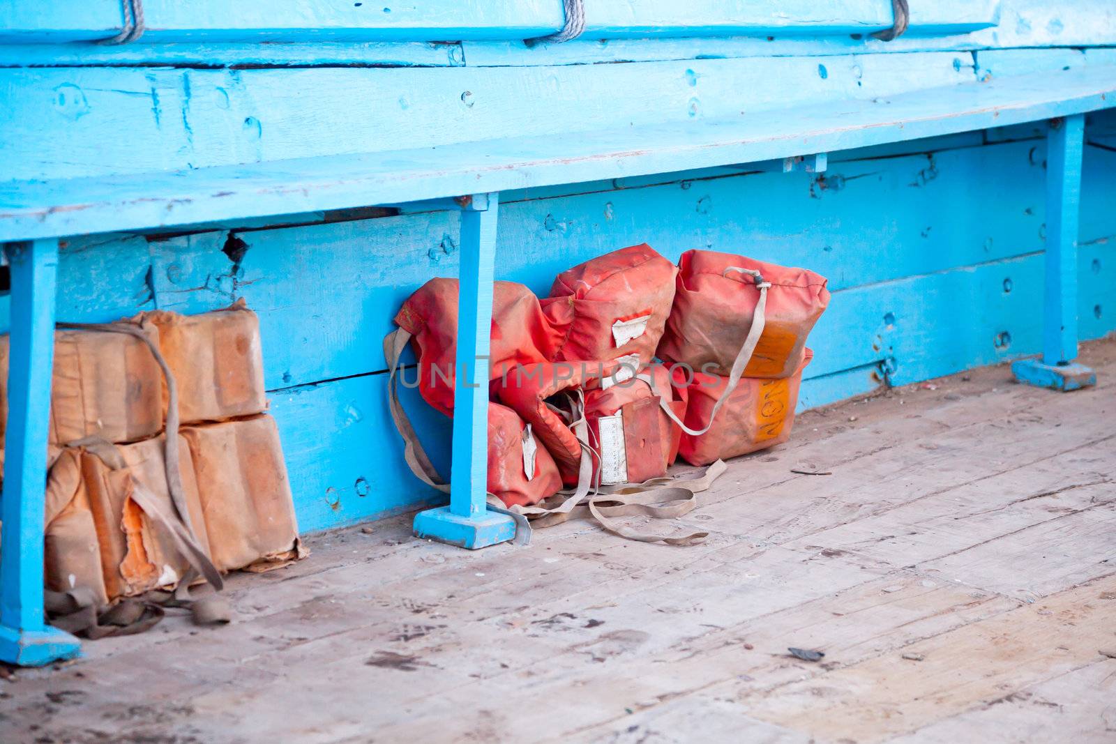 Dwarka Roadtrip. Life belt jacket under the seat on a passenger ferry in India. Generic horizontal shot, location, Bet Dwarka, Gujarat, India