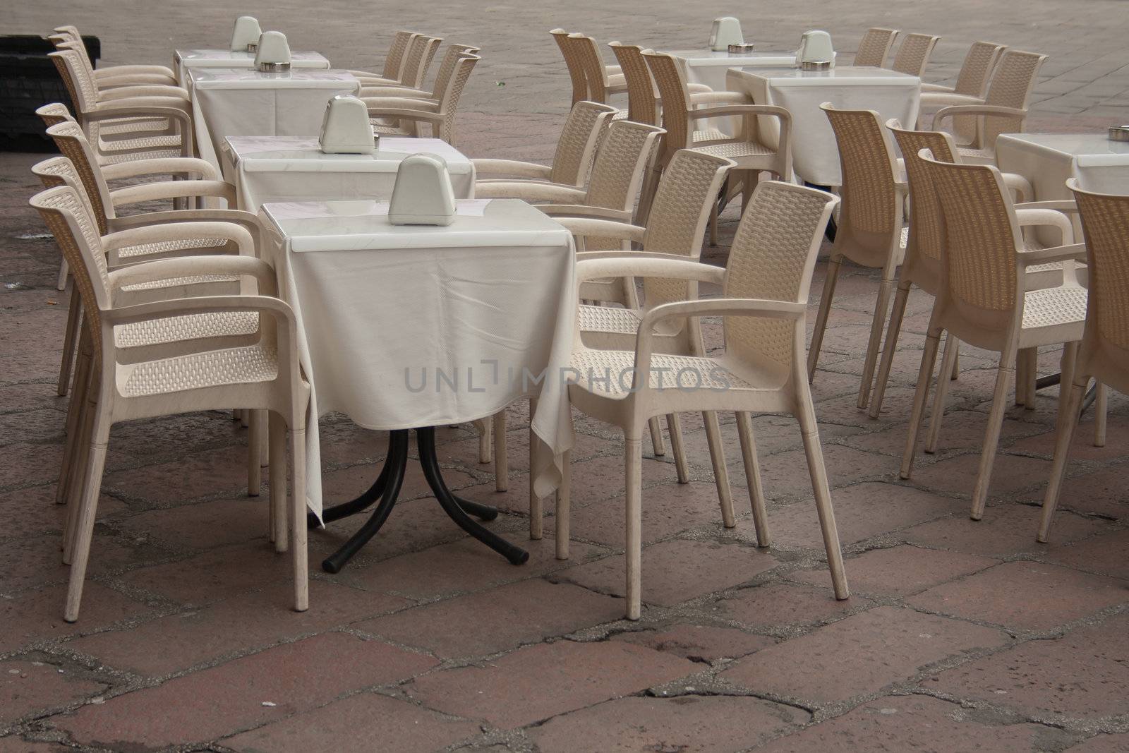 Served white table. Can be used for every celebration - as wedding, bitrhday, confirmation, christmas or just a party. Focus on flowers in front.