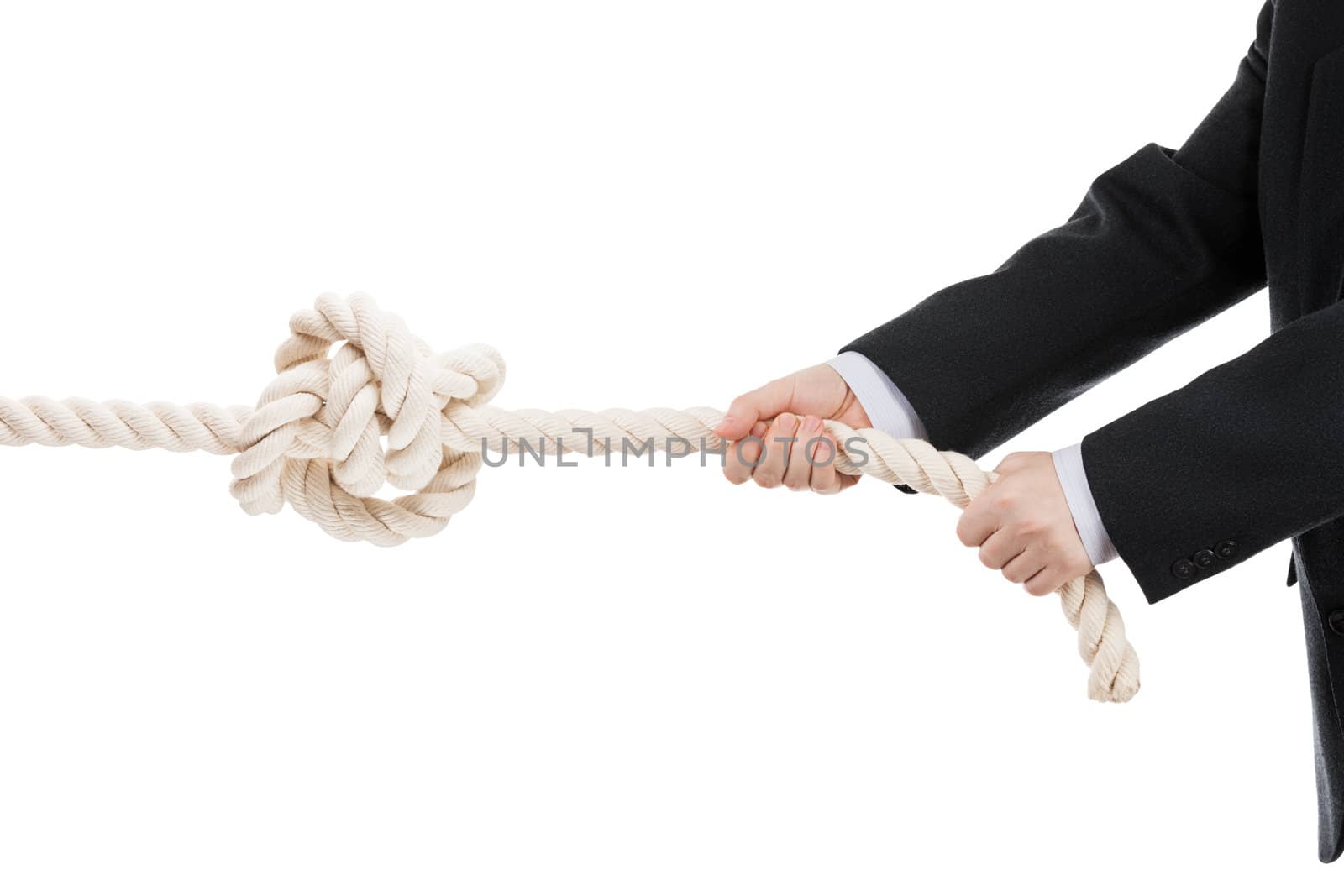 Business man hand holding or pulling rope with tied knot by ia_64