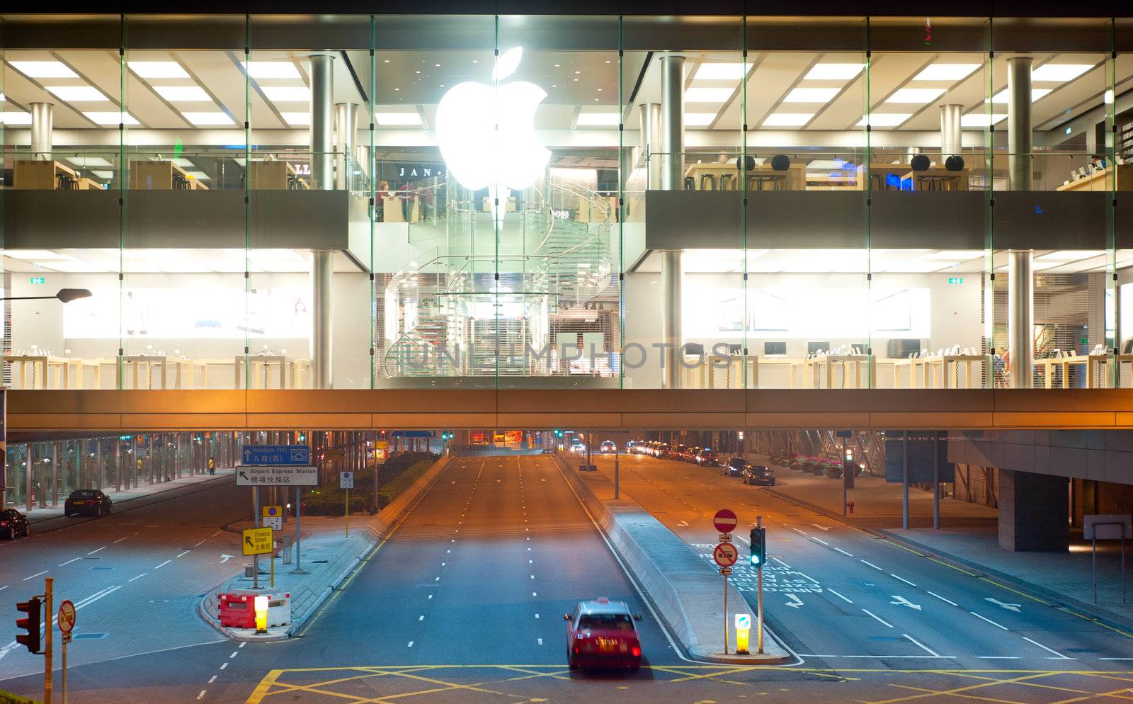 Hong Kong - January 21, 2013:  Apple store at night in Hong Kong. In 2012, Apple sold 172 million iPods, iPhones and iPads, These post-PC devices making up a total of 76-percent of Apple's revenue.