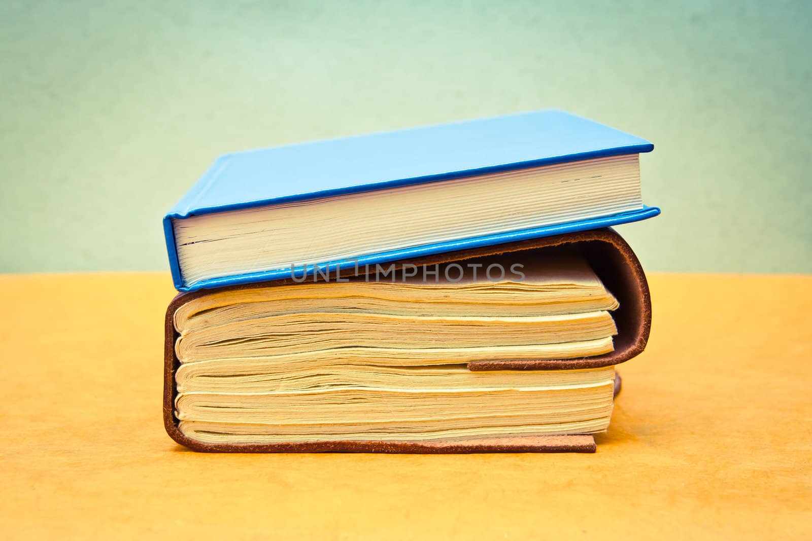 Two books in pastel tones as a still life image